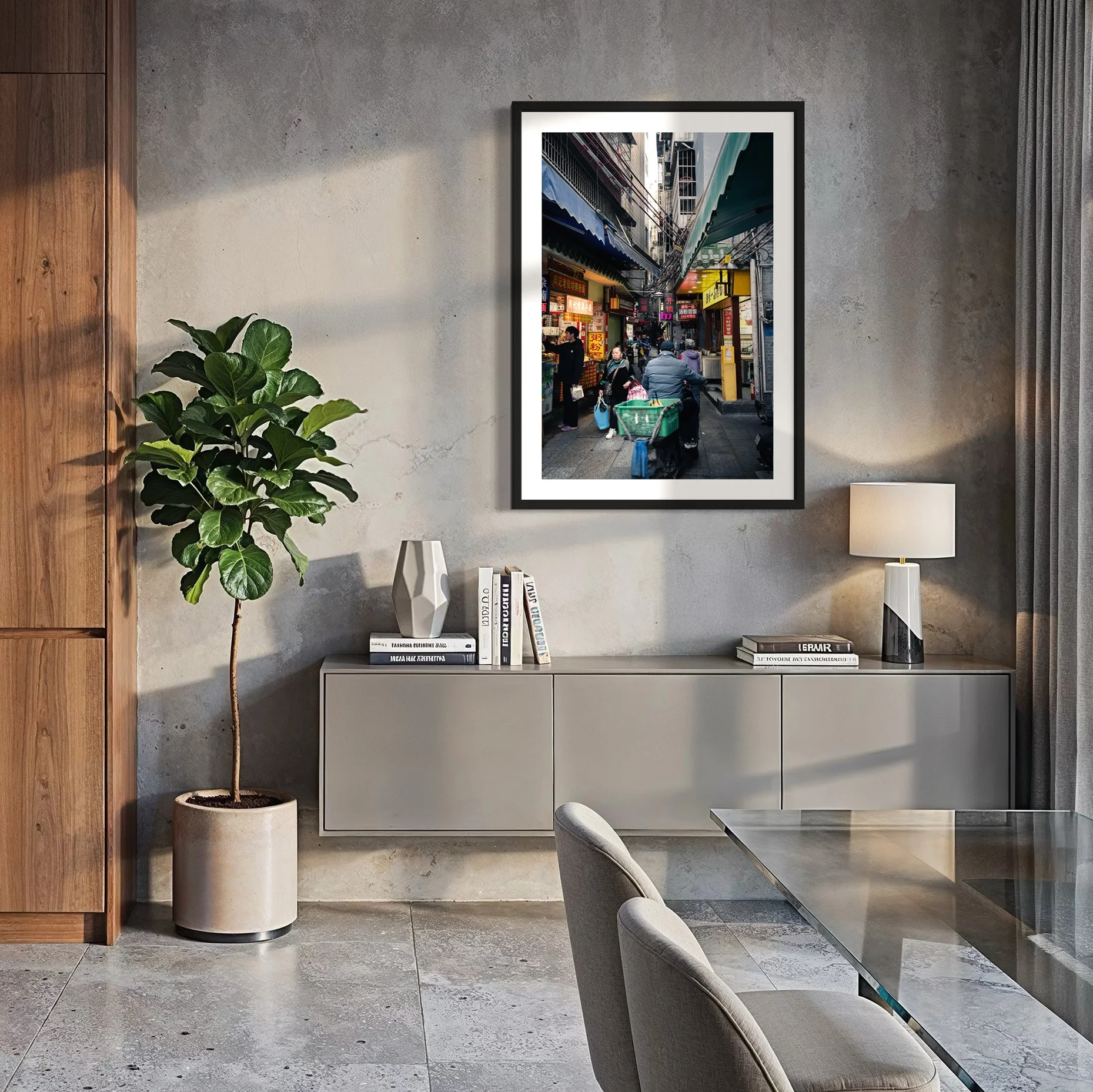 Framed Guangzhou alley street photography print displayed in a contemporary dining room with concrete walls, warm natural light, timber accents and minimalist furnishings.