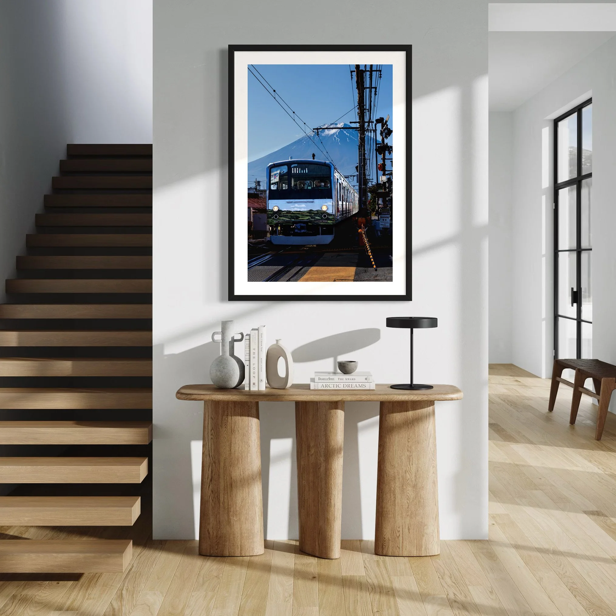 Mount Fuji train photographic print displayed above a wooden console table