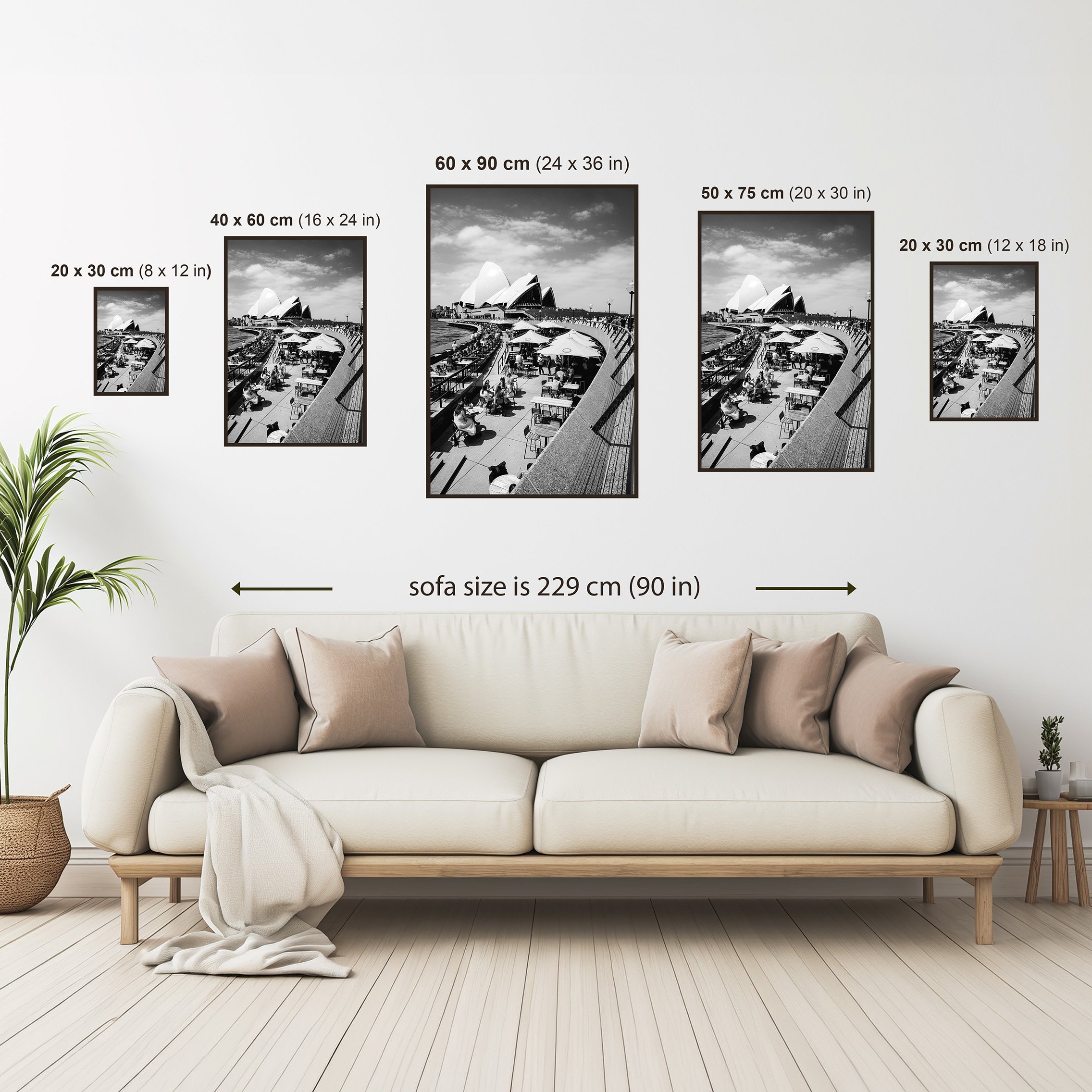 Size comparison guide showing the Sydney Opera House print displayed above a sofa in multiple available print sizes from 20 × 30 cm to 60 × 90 cm.