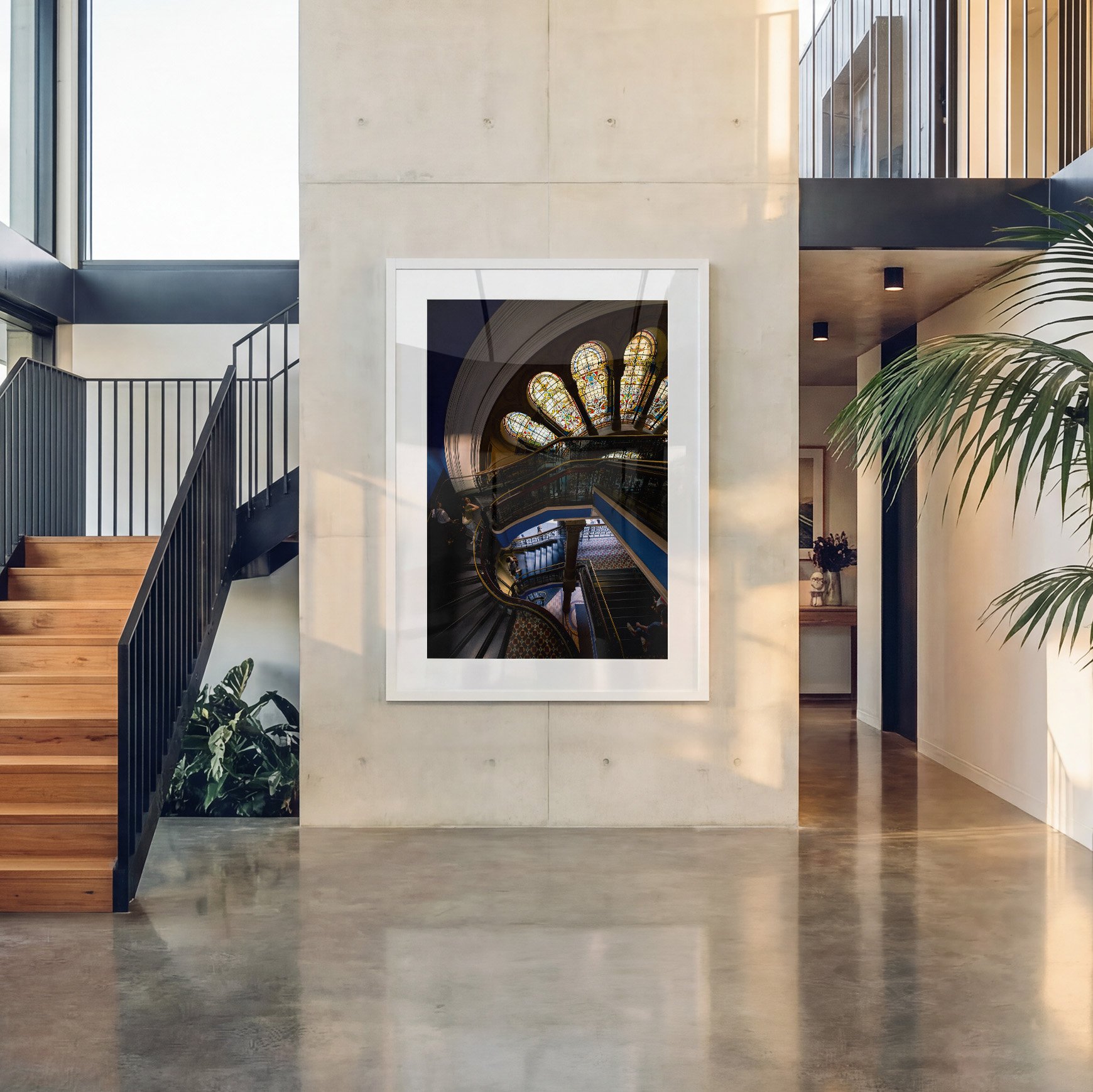Queen Victoria Building architecture photography print displayed in a white frame with white mat in a bright contemporary concrete entryway.