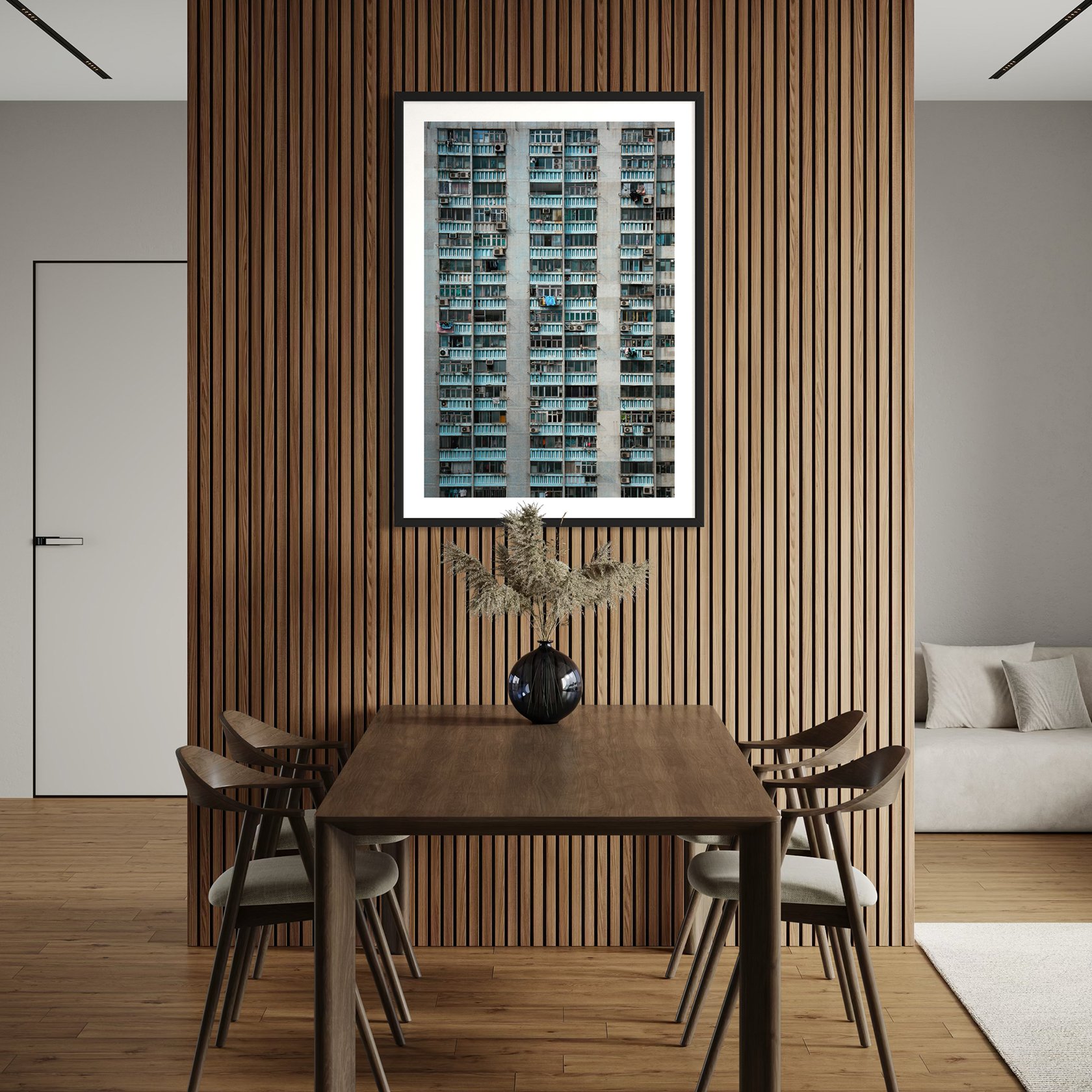 Hong Kong apartment facade wall art displayed above a wooden dining table against vertical timber wall panels.