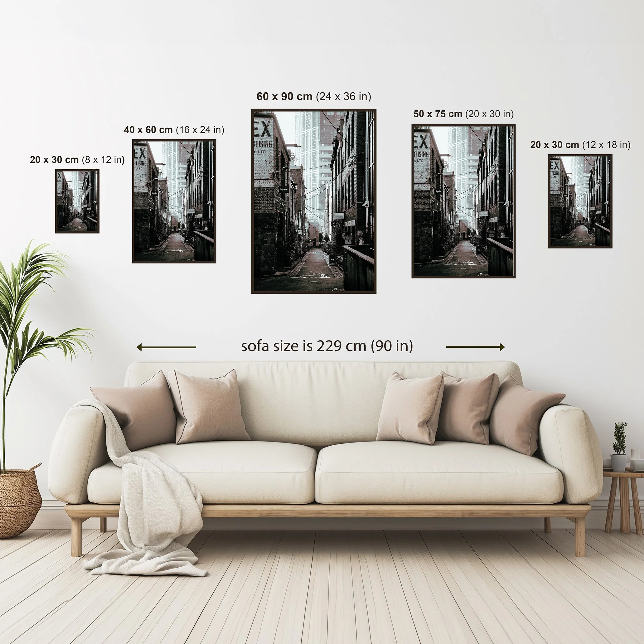 Melbourne laneway wall art size guide showing available framed print dimensions above a neutral sofa setting.
