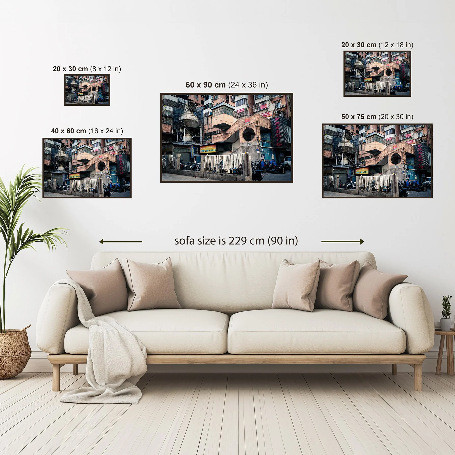 Size guide showing the Guangzhou architecture print displayed above a sofa in four available sizes.