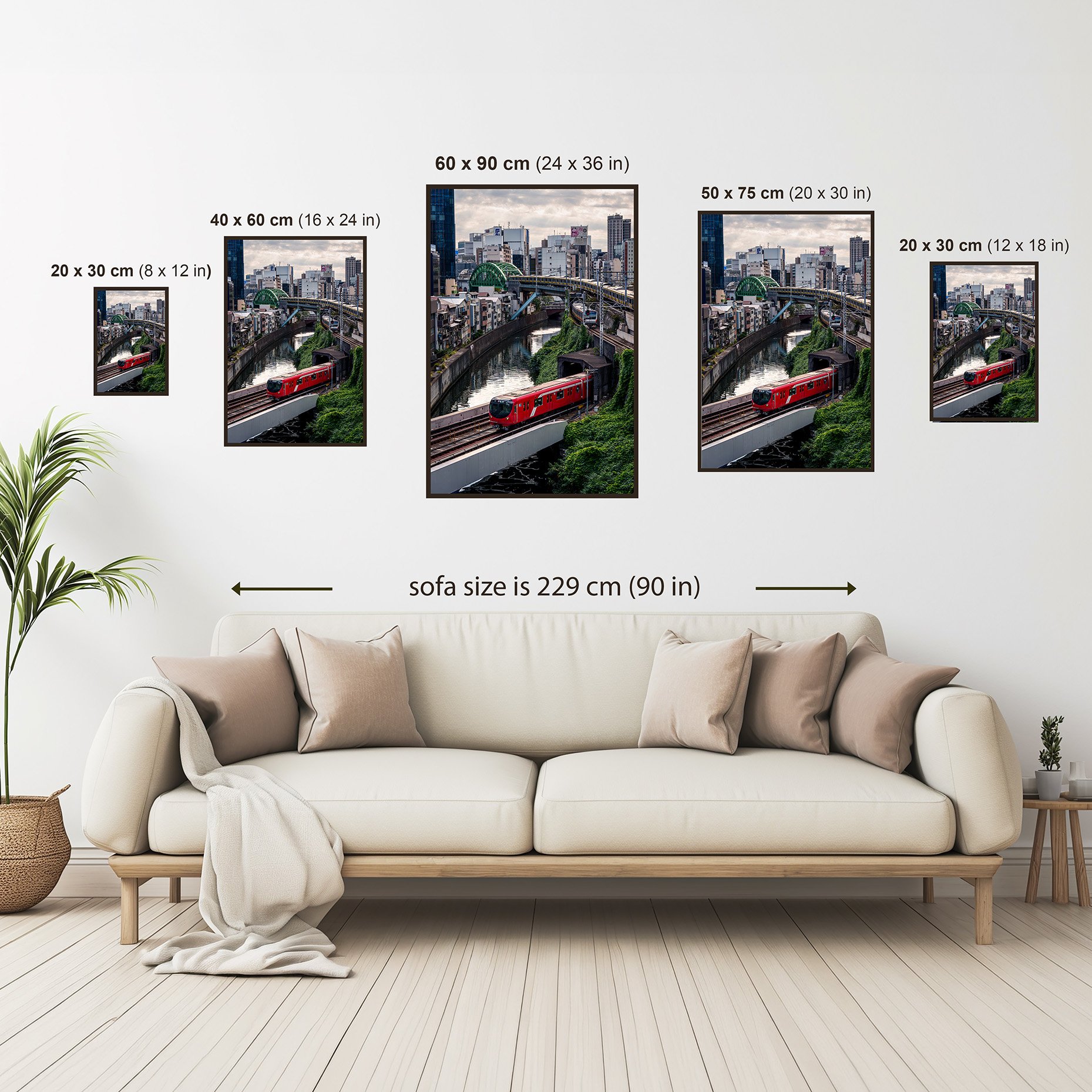 Size guide showing the Tokyo train photography print above a sofa in five available sizes.