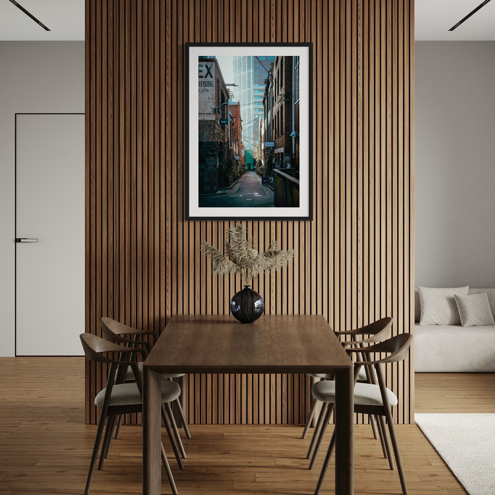 Vertical Melbourne laneway wall art displayed above a wooden dining table against a slatted timber feature wall.