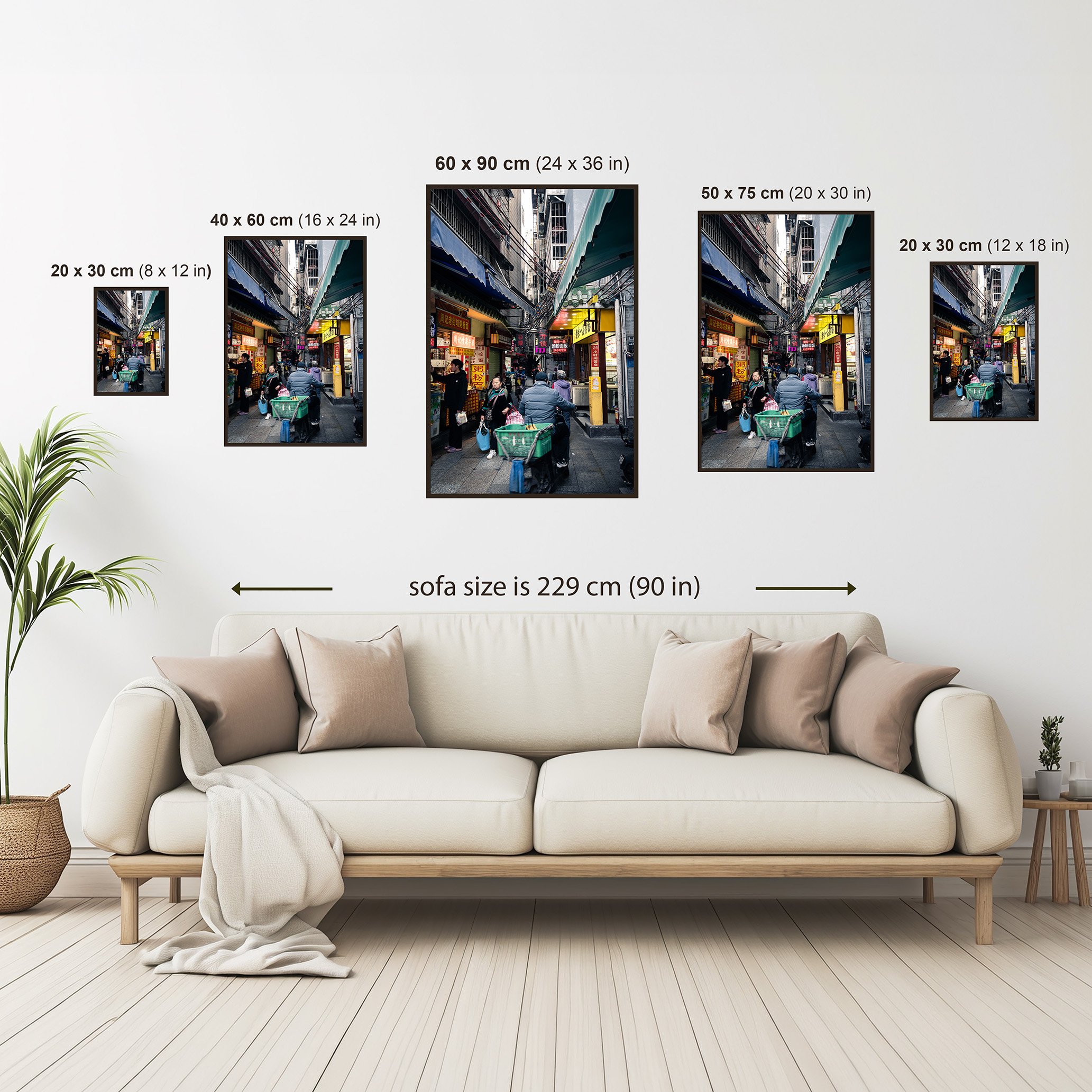 Size comparison guide showing the Guangzhou alley photography print in multiple available sizes displayed above a sofa for scale reference.