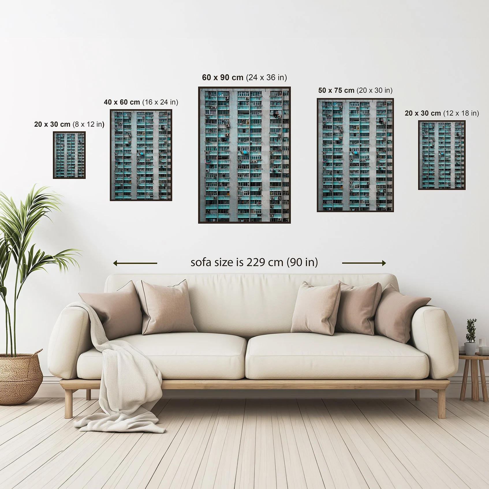 Wall art size comparison guide showing available print sizes above a sofa for scale reference.