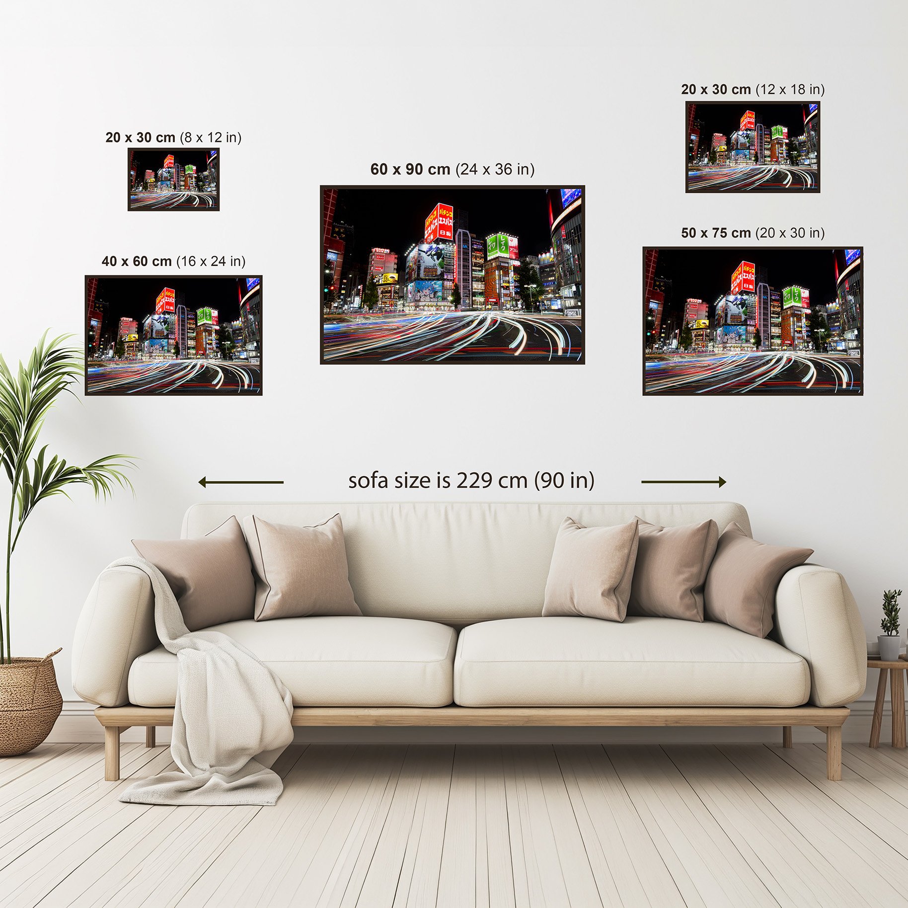 Size comparison guide showing Tokyo Light Layers photography print in multiple dimensions above a sofa for wall art scale reference.