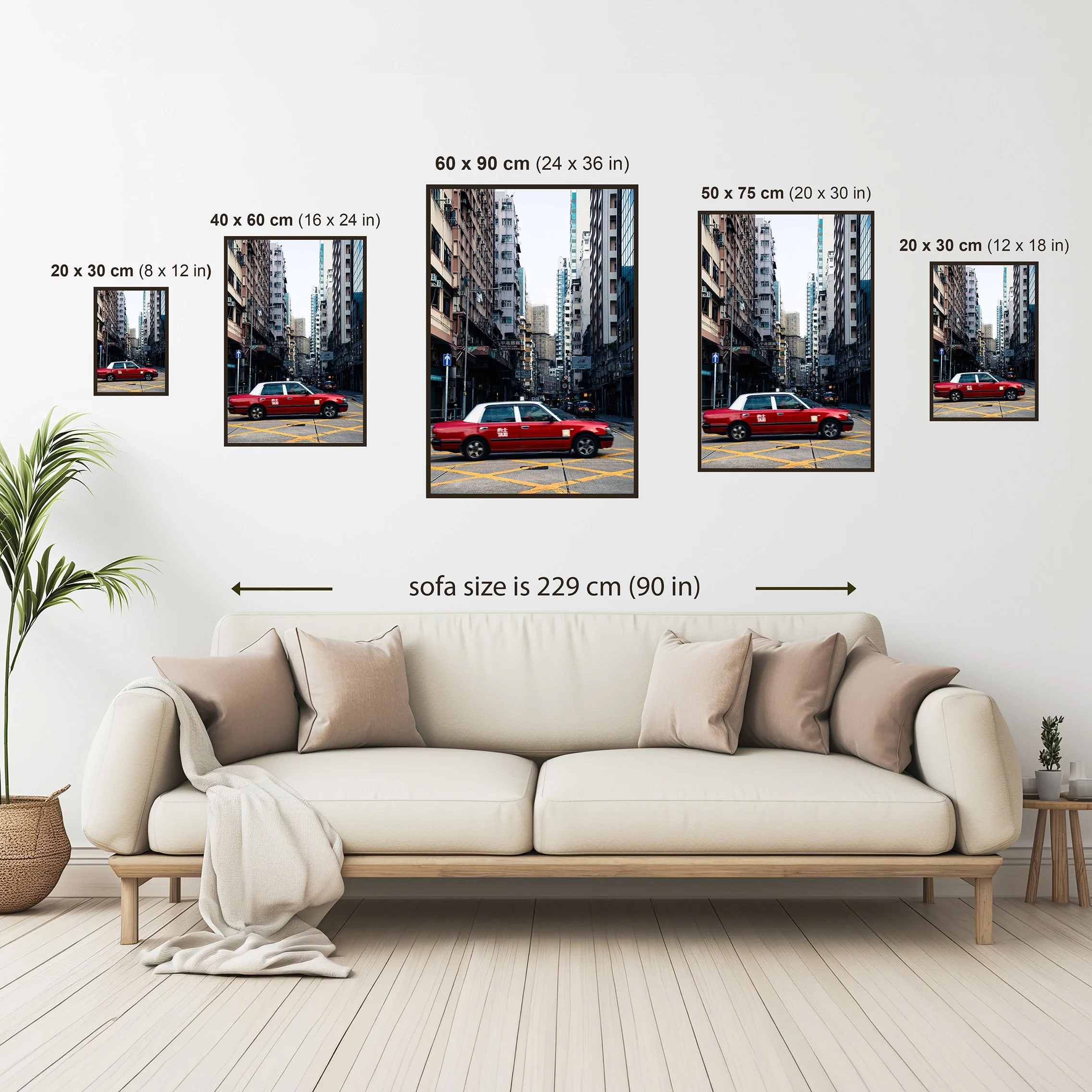 Size guide showing available vertical print sizes from 20 x 30 cm to 60 x 90 cm above a neutral sofa for scale reference.