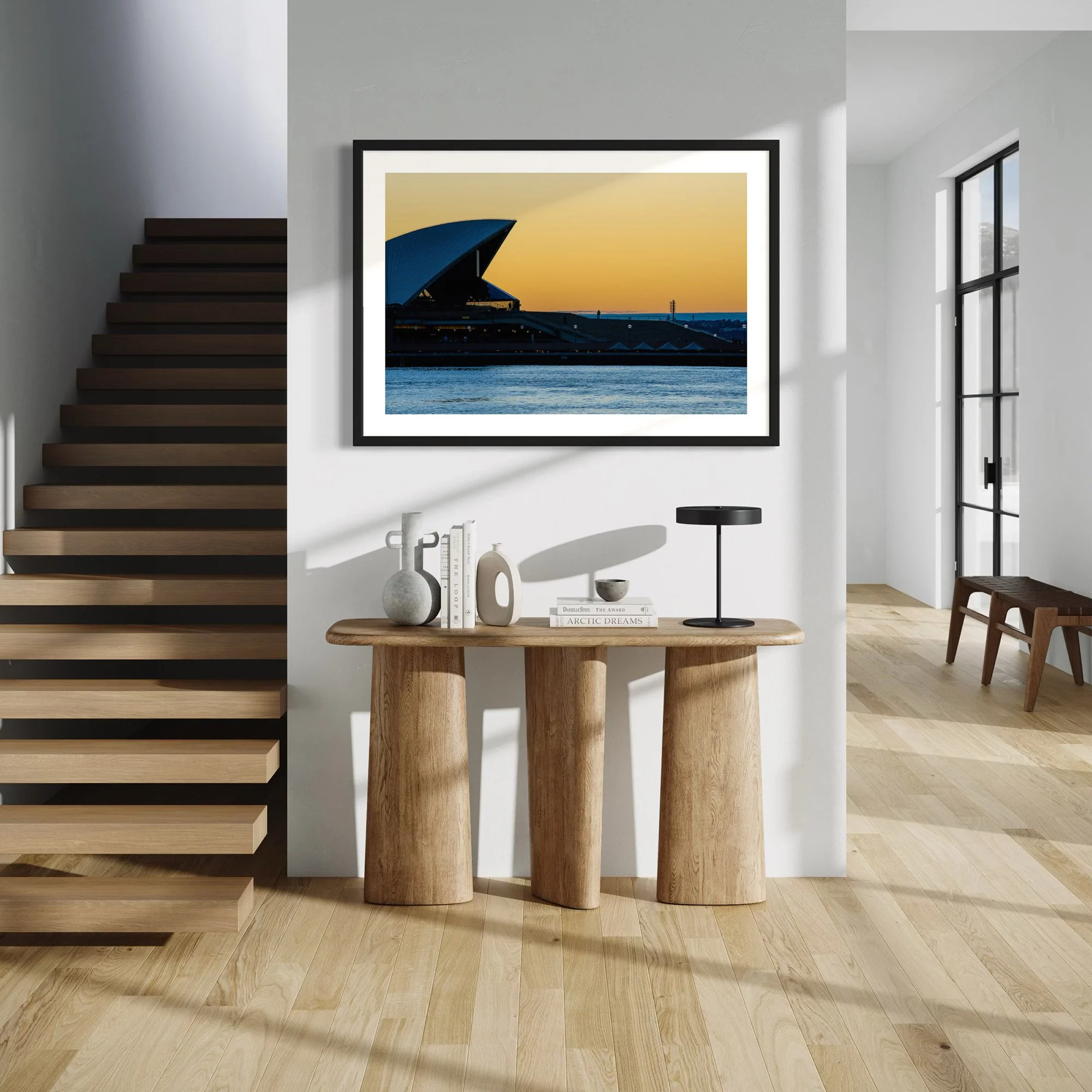 Opera House Sunrise fine art photography print styled in a bright modern hallway with timber stairs and minimalist furniture.