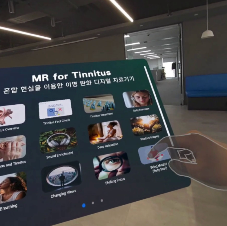 A person holding a digital info board about tinnitus treatments and exercises in a modern indoor space.