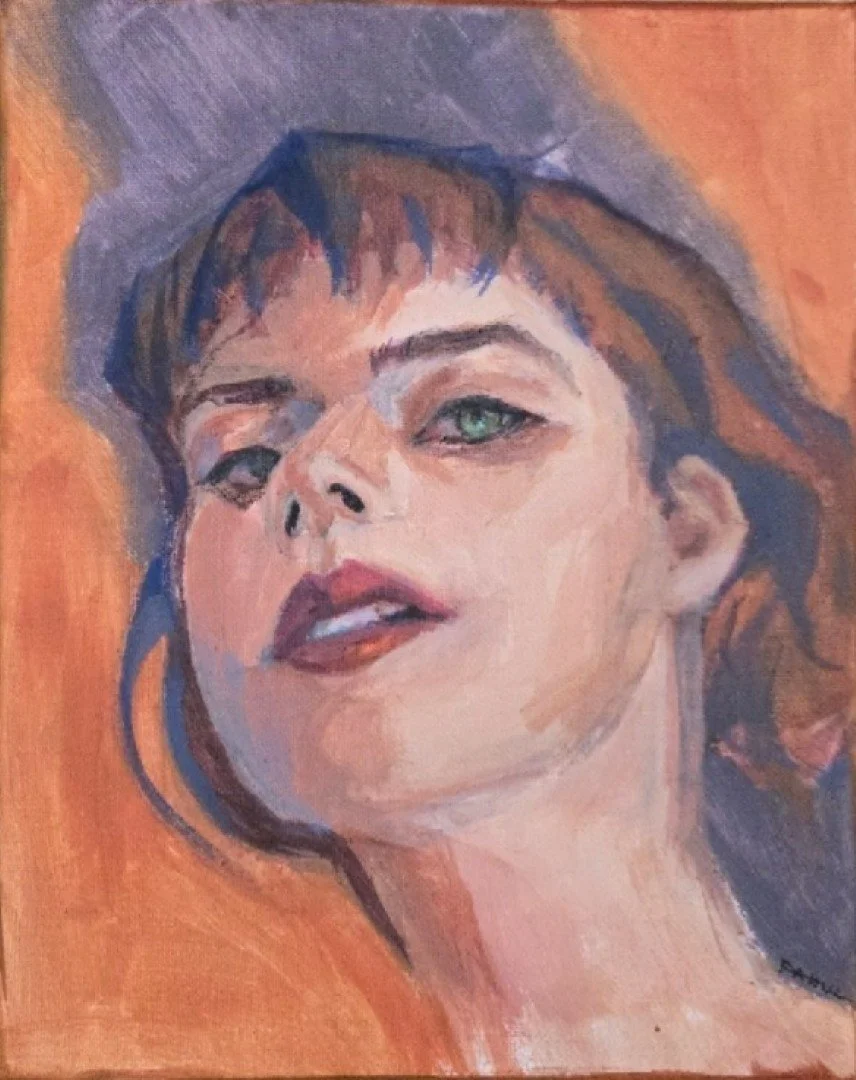 Portrait of a woman with short brown hair and blue eyes, looking slightly upward with lips slightly parted, set against an orange background.