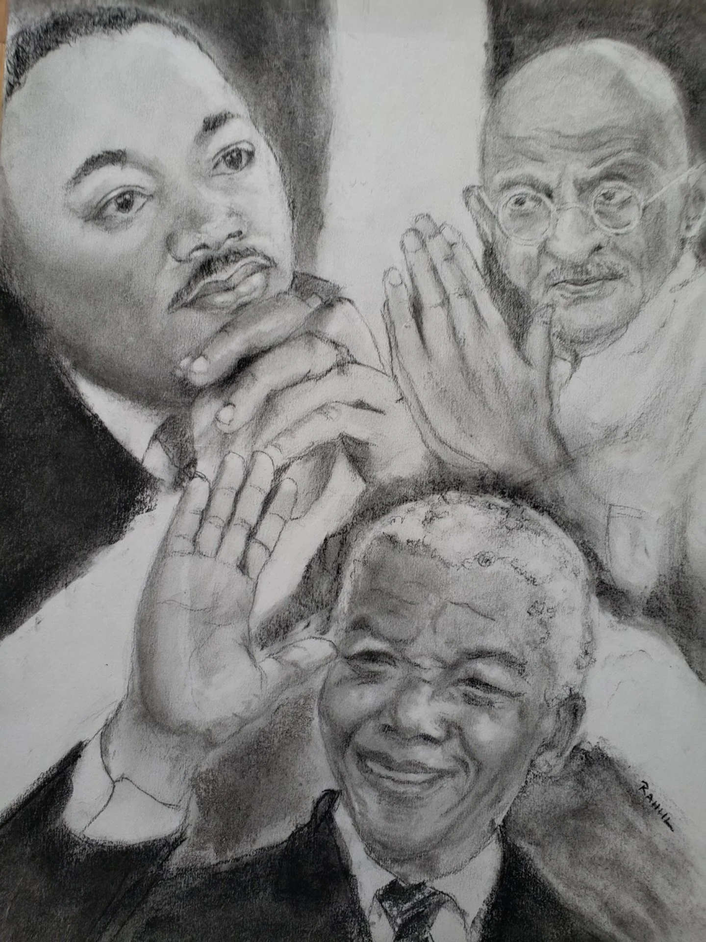 A charcoal triple portrait of peace with Martin Luther King Jr, Mahatma Gandhi and Nelson Mandela