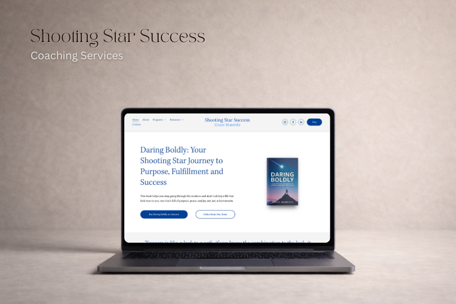 A laptop displaying a webpage for Shooting Star Success coaching services, featuring a book titled "Daring Boldly: Your Shooting Star Journey to Purpose, Fulfillment, and Success." The background is neutral and textured.