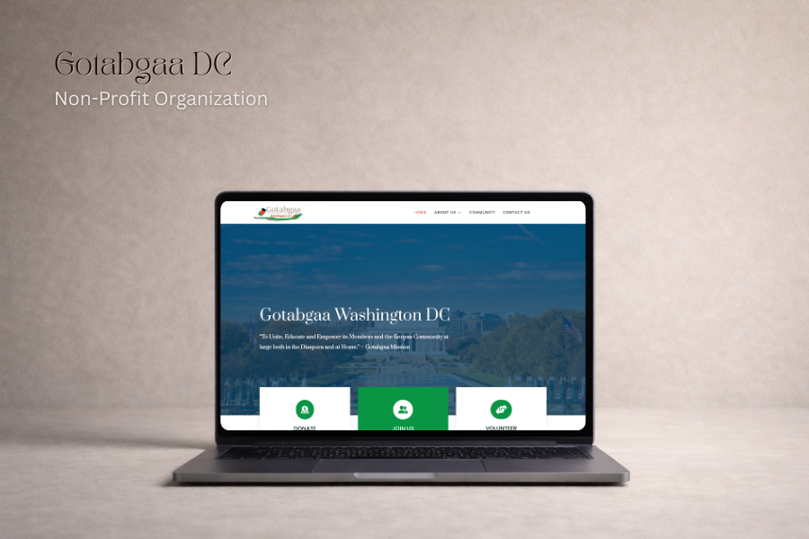 Laptop displaying the homepage of Gotabgaa Washington DC, a non-profit organization, with navigation menu and green donation, join, and volunteer buttons.