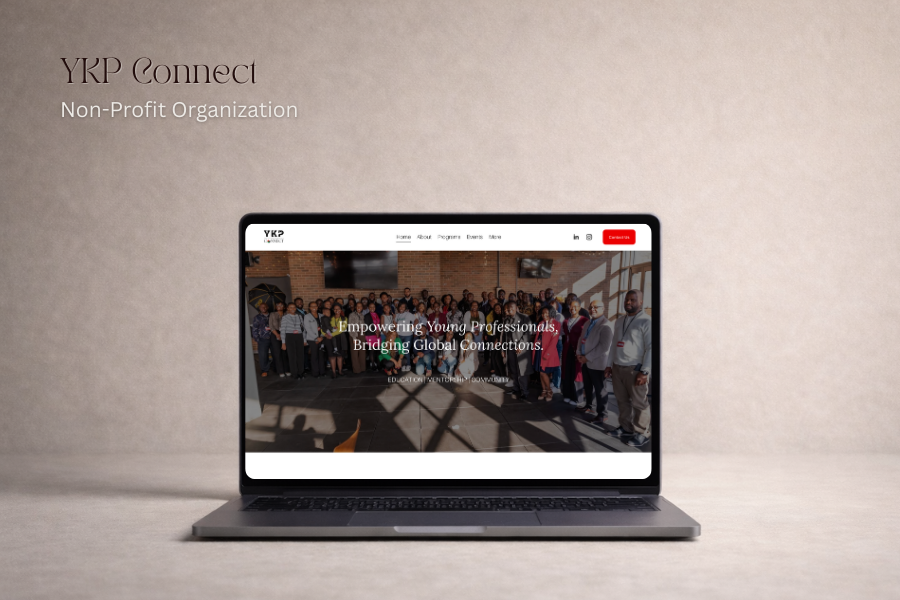 Laptop displaying the homepage of YKP Connect, a non-profit organization focused on empowering young professionals and bridging global connections, with a group photo on the website.