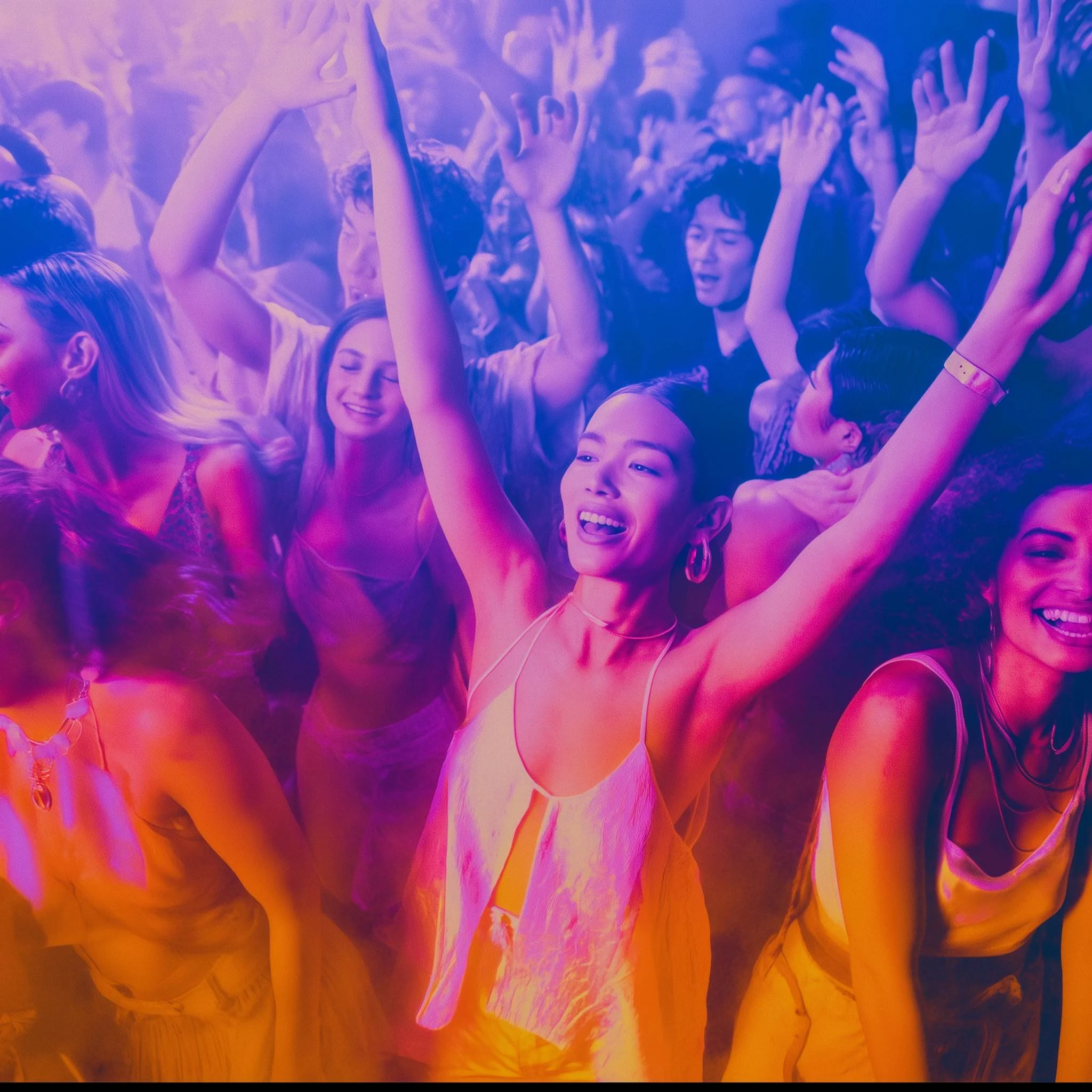 A diverse group of people dancing at a party or nightclub, with a woman in the foreground joyfully raising her arms, smiling, and surrounded by others enjoying themselves.