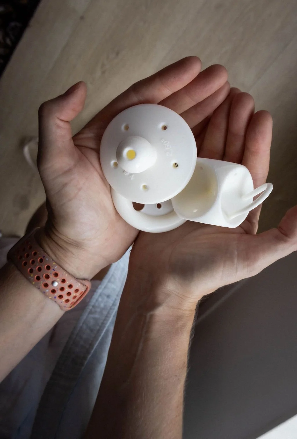 A pelvic health physio's hands holding a selection of vaginal pessaries, used to help with symptoms of prolapse and incontinence.