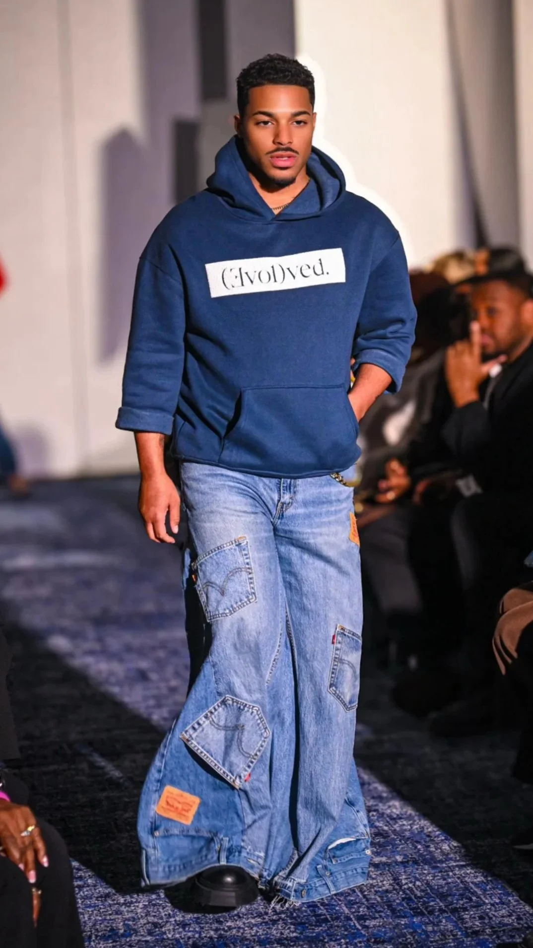 Reconstructed palazzo jeans made from vintage denim with wide-leg structure and signature inverted waistband hem. Limited edition designer statement piece.