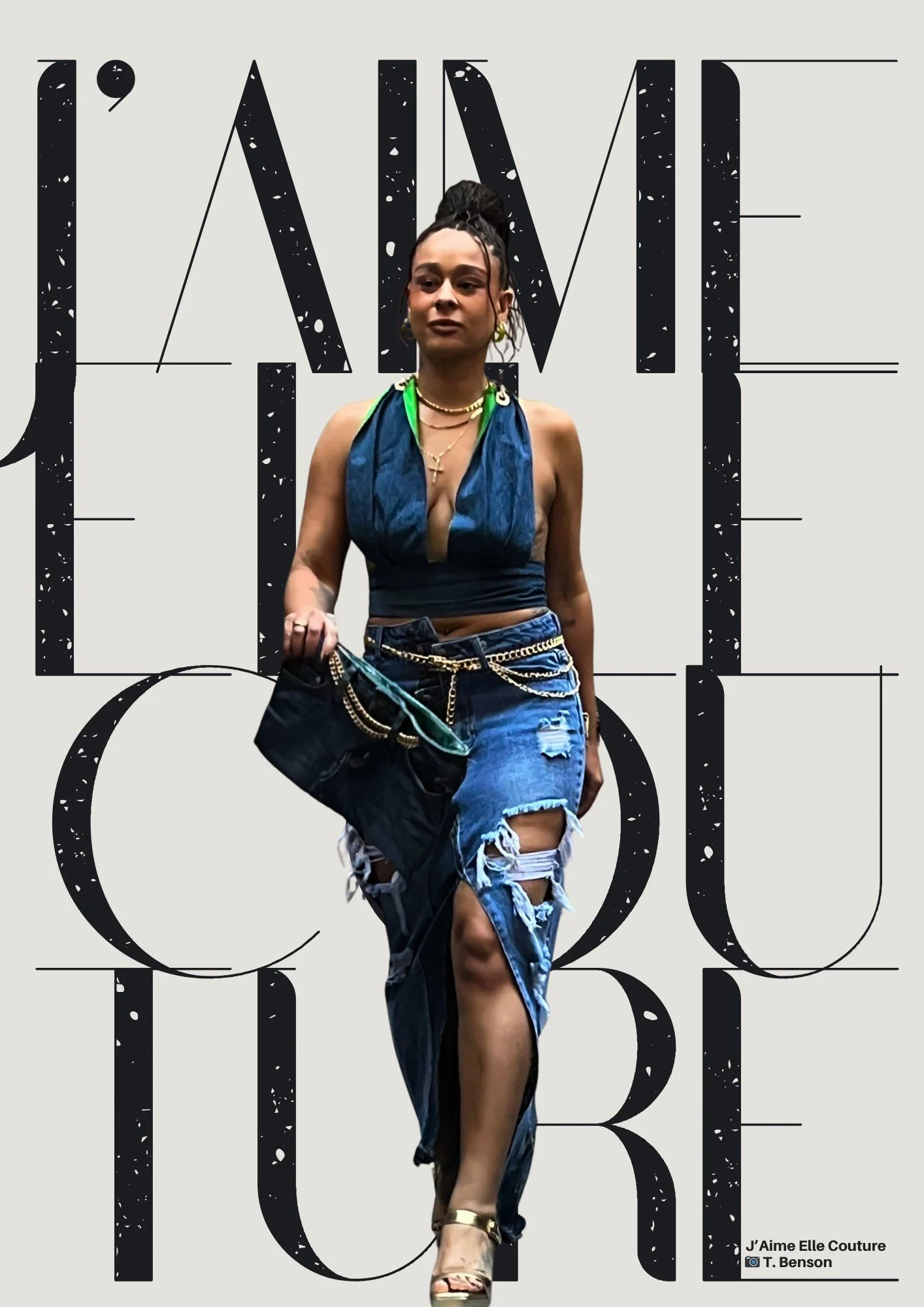 A woman walking in front of a background with text that reads 'J'aime Elle Couture'. She is wearing a denim outfit with a plunging neckline, distressed skirt with a high slit, and heels. She carries a denim bag and has multiple jewelry accessories.