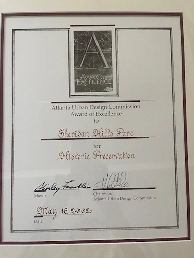Certificate of Award of Excellence from the Atlanta Urban Design Commission awarded to Sheridan Mills Pare for Historic Preservation, dated May 16, 2002, signed by the mayor and the commission chairman.