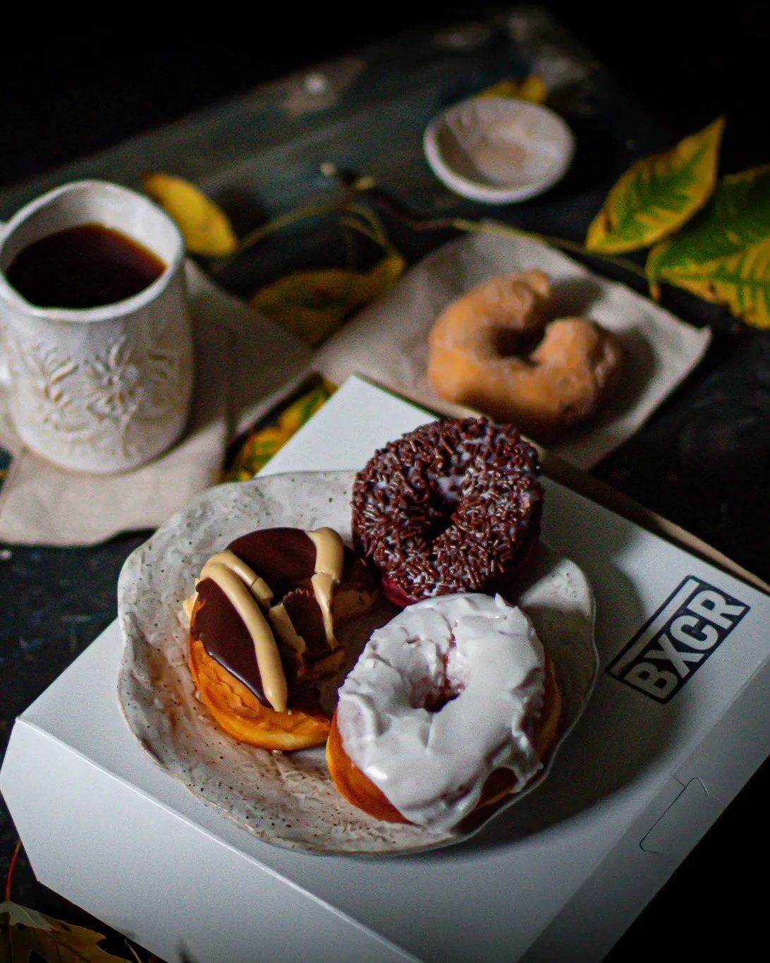 A plate of donuts on handmade dinnerware