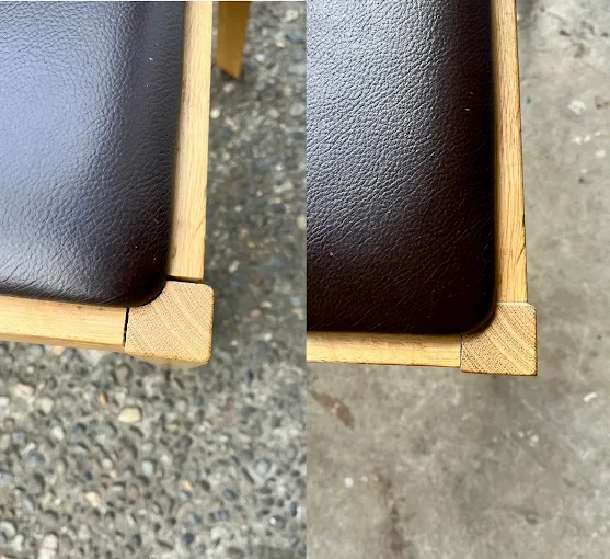 Close-up of a wooden table corner with a black surface, showing a misaligned joint on the left and a properly aligned corner on the right.