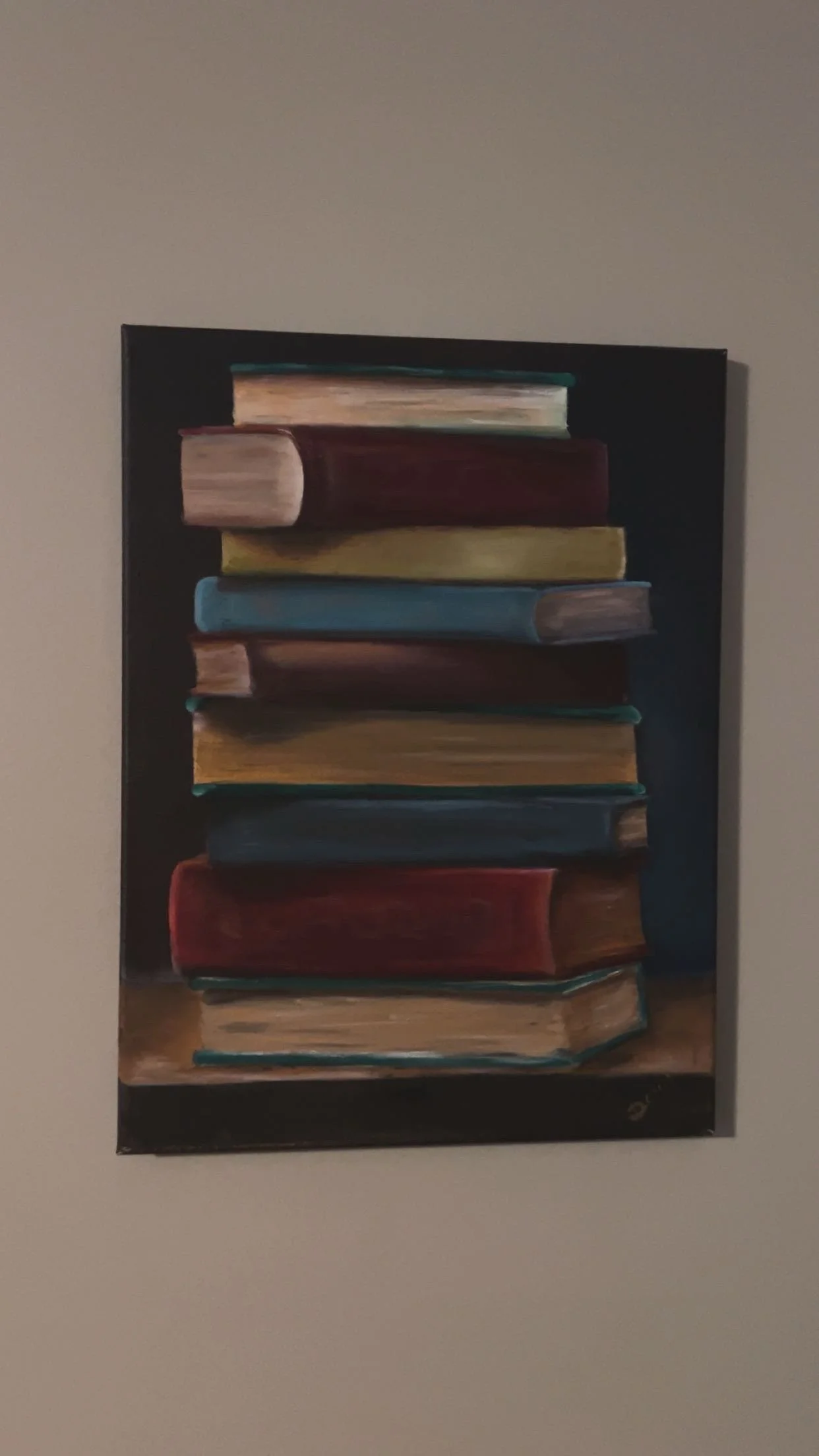 Painting of a stack of colorful books on a wooden surface against a dark background.