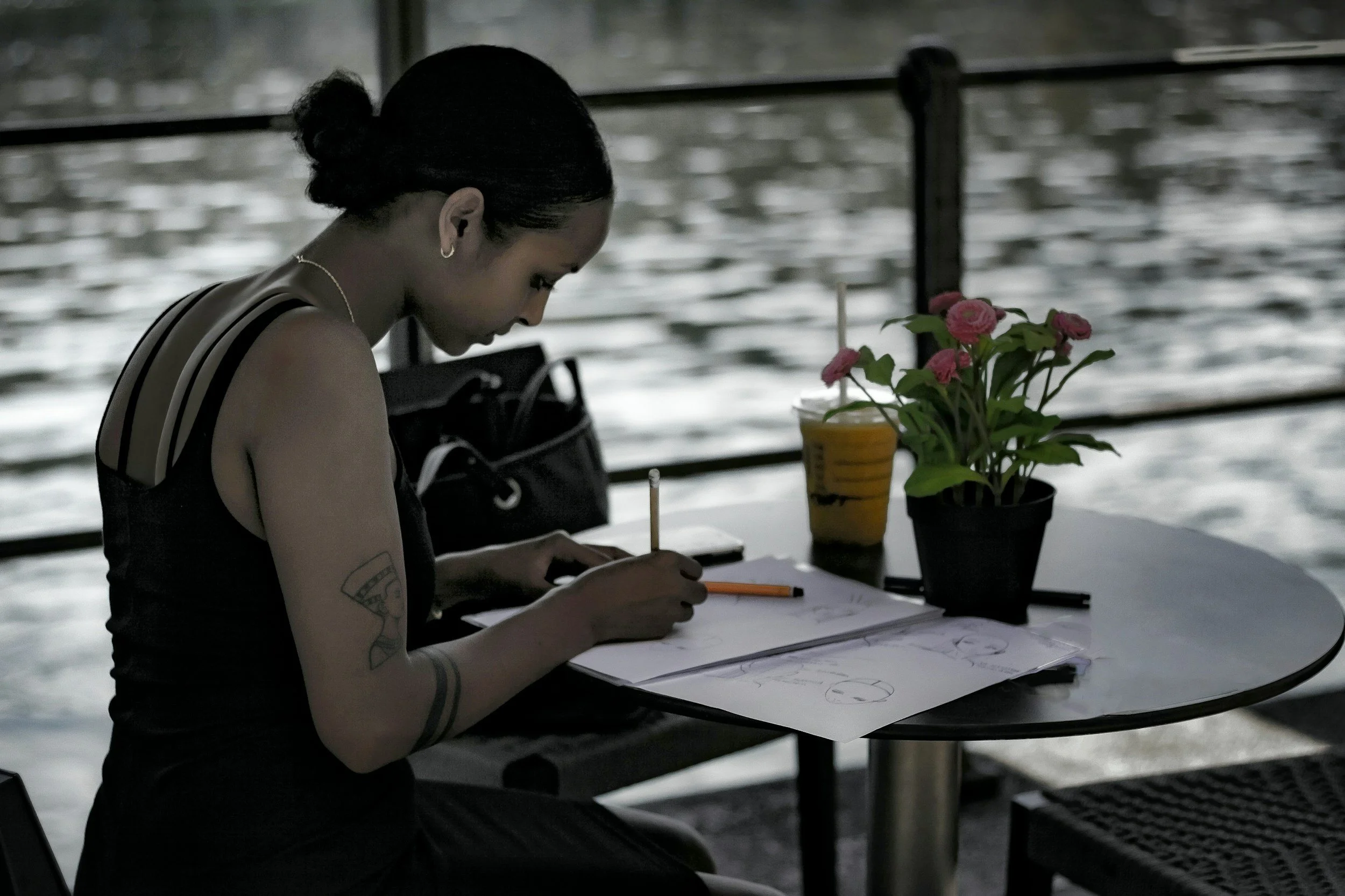 woman writing in journal contemplating fertility awareness as birth control without hormones.
