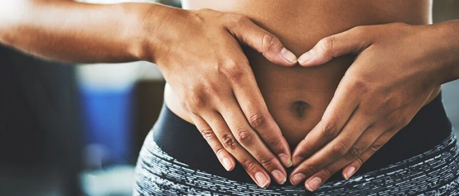 Woman happily using the sympto-thermal fertility awareness method for natural birth control.