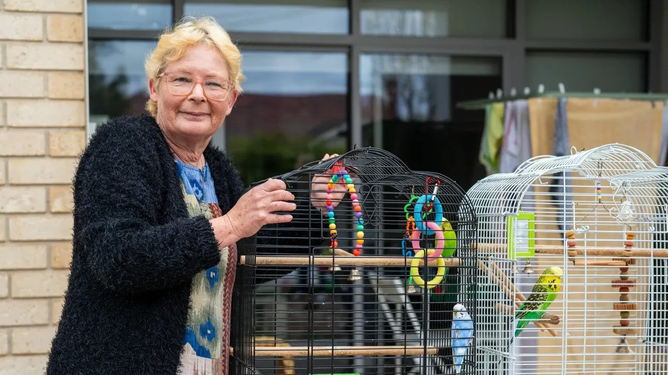 A Summerhill resident standing on her balcony.
