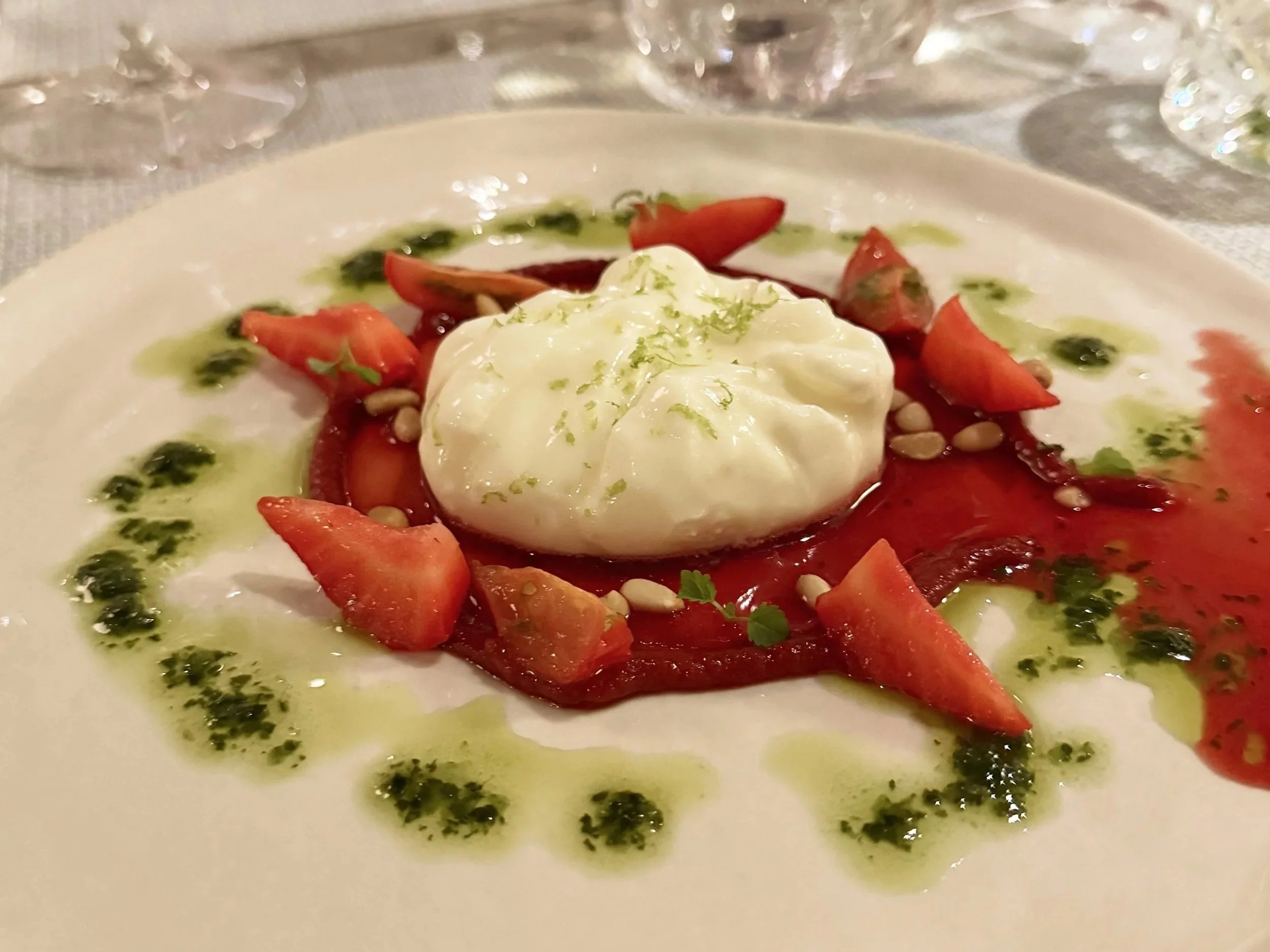  Burrata with strawberries, toasted pine nuts, lime zest and herb oil, a dinner course aboard EXPLORA I as the ship sailed north from Patmos. 