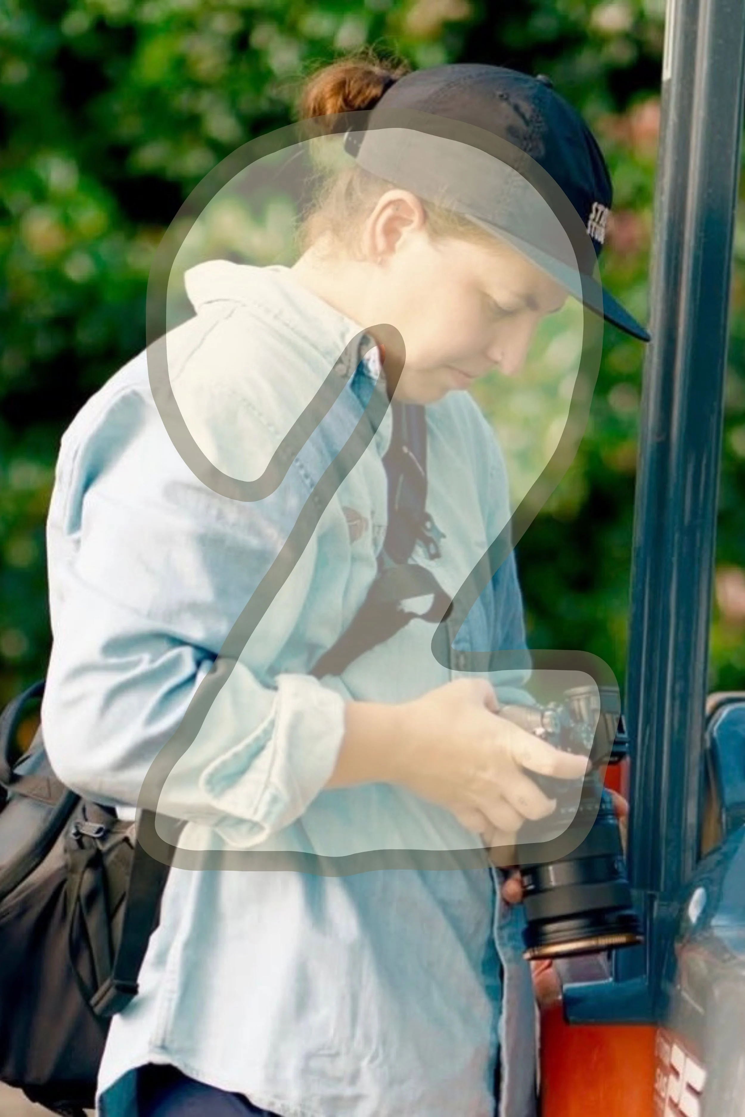 Interior of a coffee shop with a black sign hanging that reads 'COFFEE' and a larger sign above that says 'MILKHOUSE' in bold black letters.