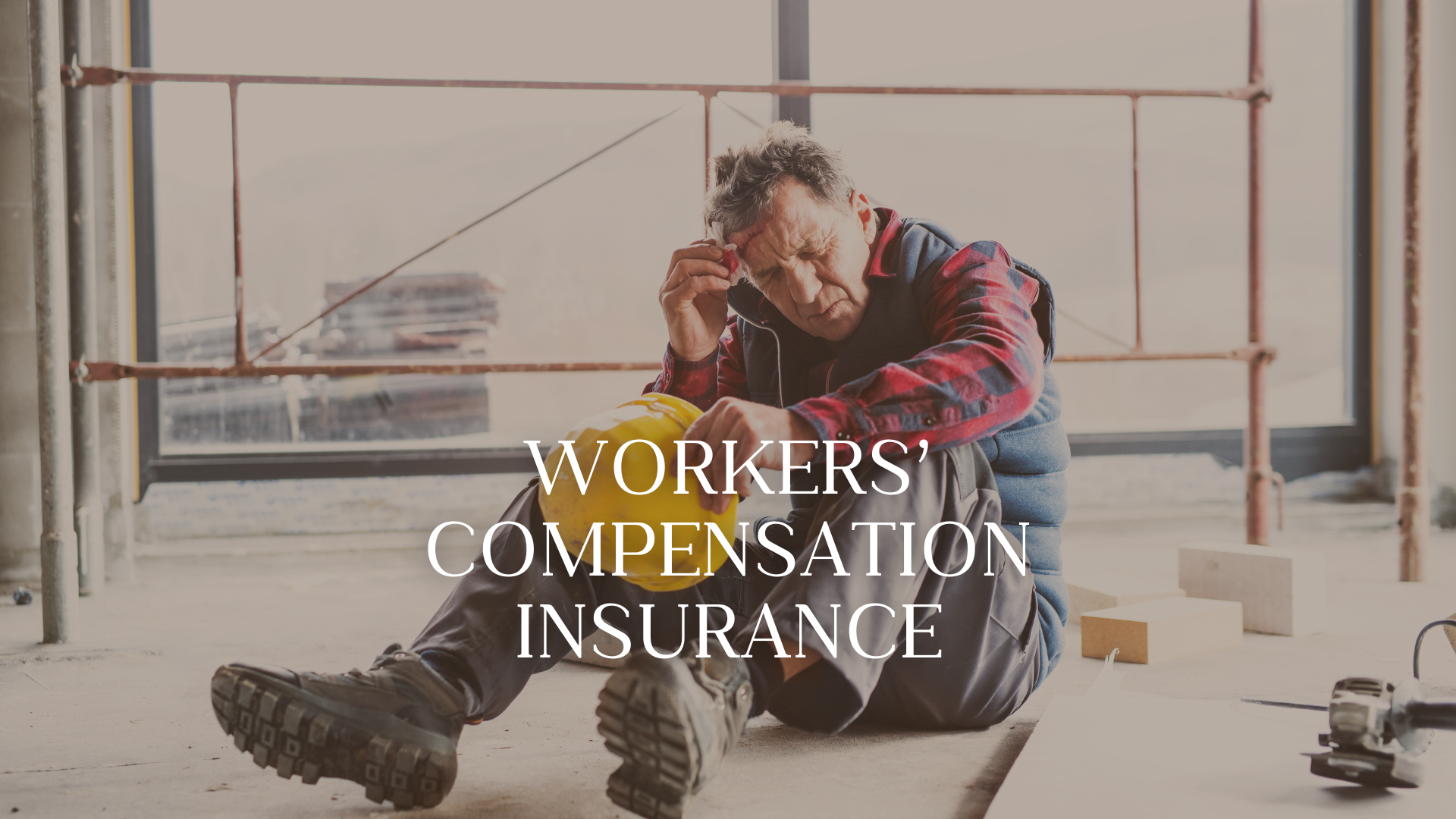 An injured construction worker sitting on the floor inside a building with construction scaffolding around him, holding his head and a yellow safety helmet, appearing distressed. Overlaid text reads 'Workers' Compensation Insurance'.