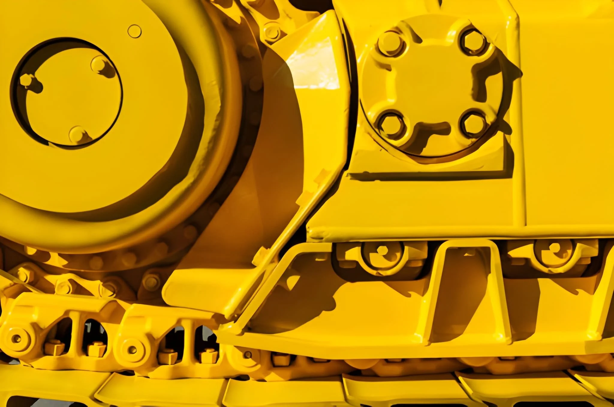 Close-up of a yellow mechanical robot or machinery with detailed parts and bolts.
