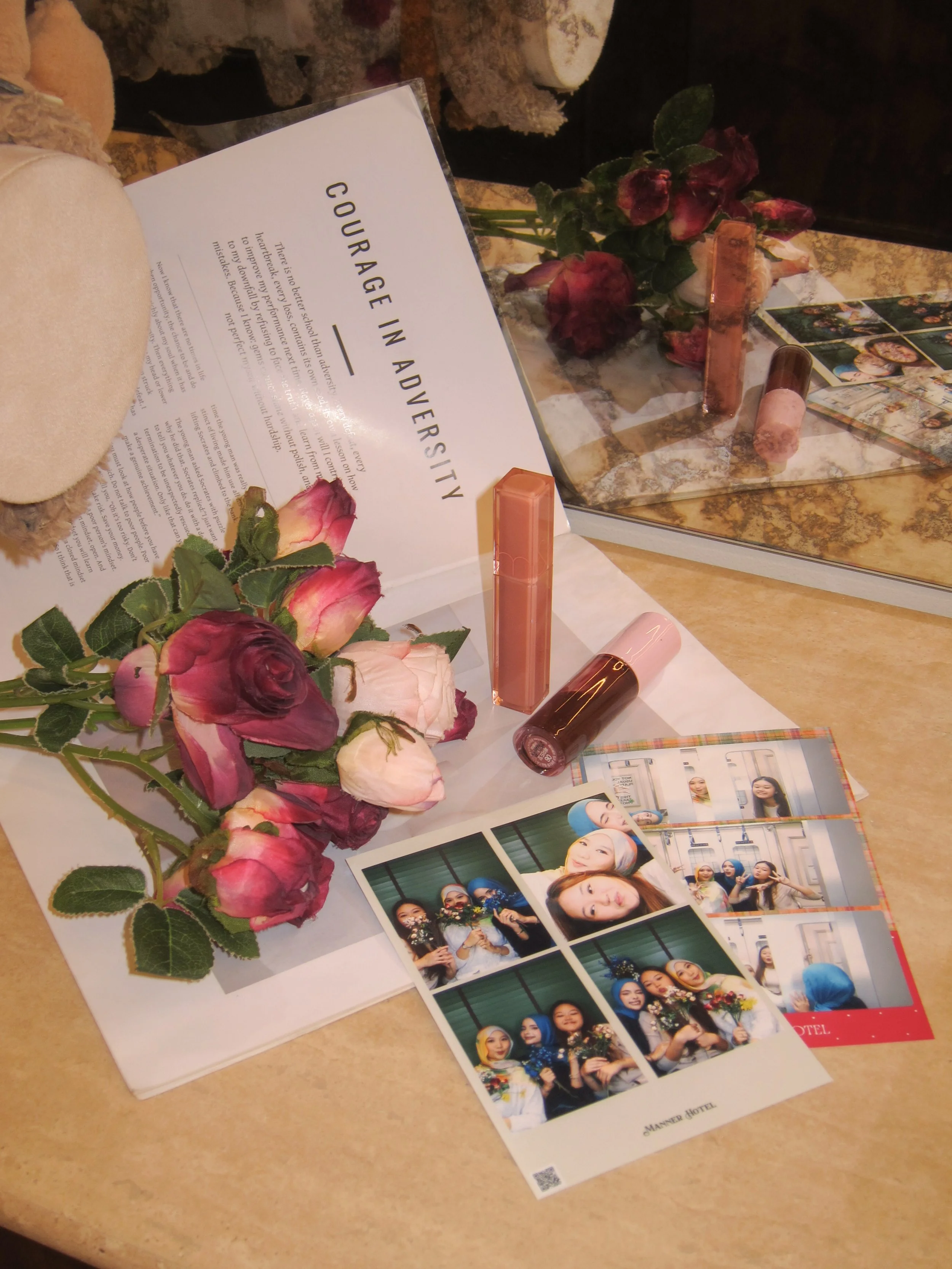 Photographs of a group of friends celebrating, some holding flowers, and a printed magazine,
