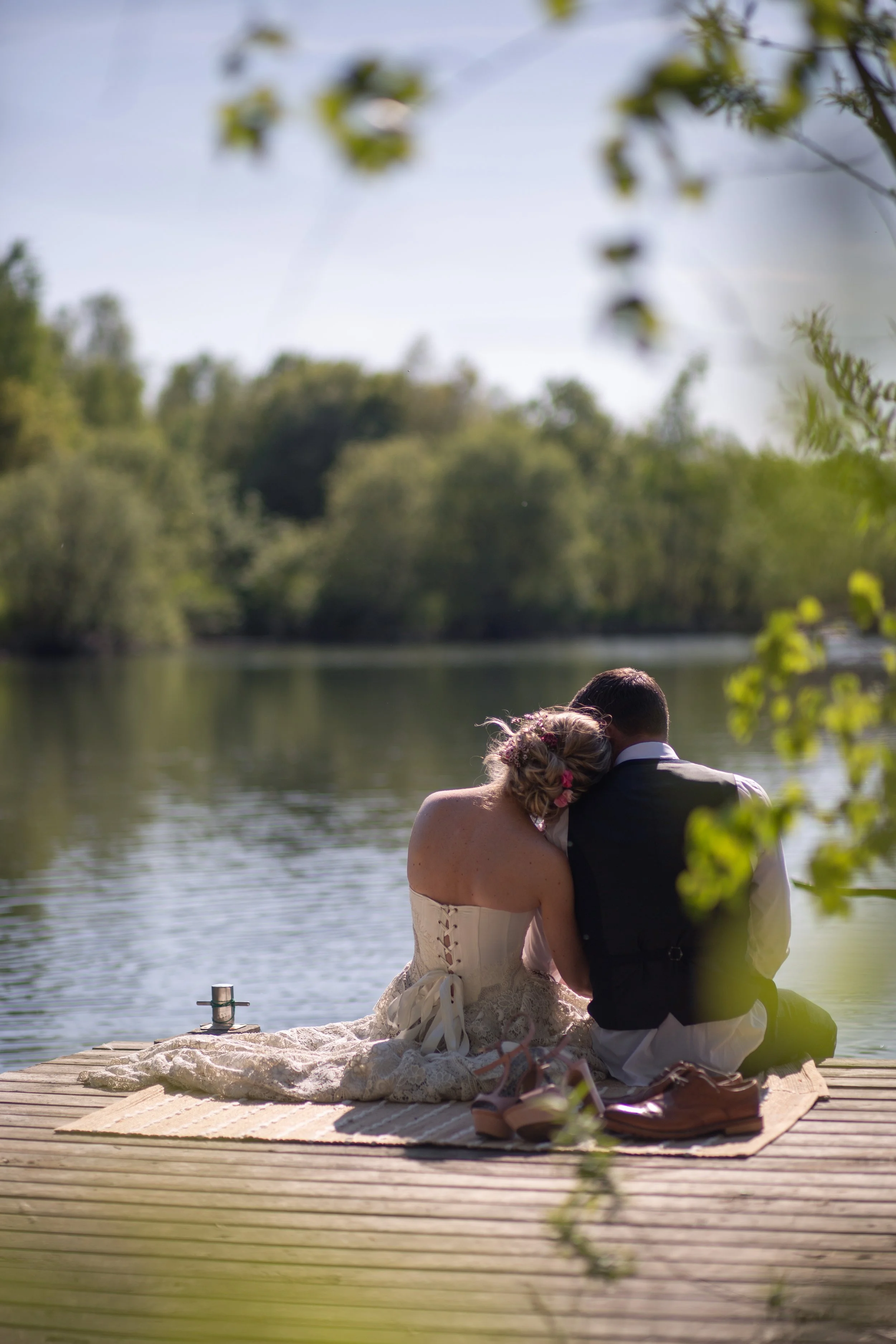 Couple renewing vowels by lake by Everlong Ceremonies