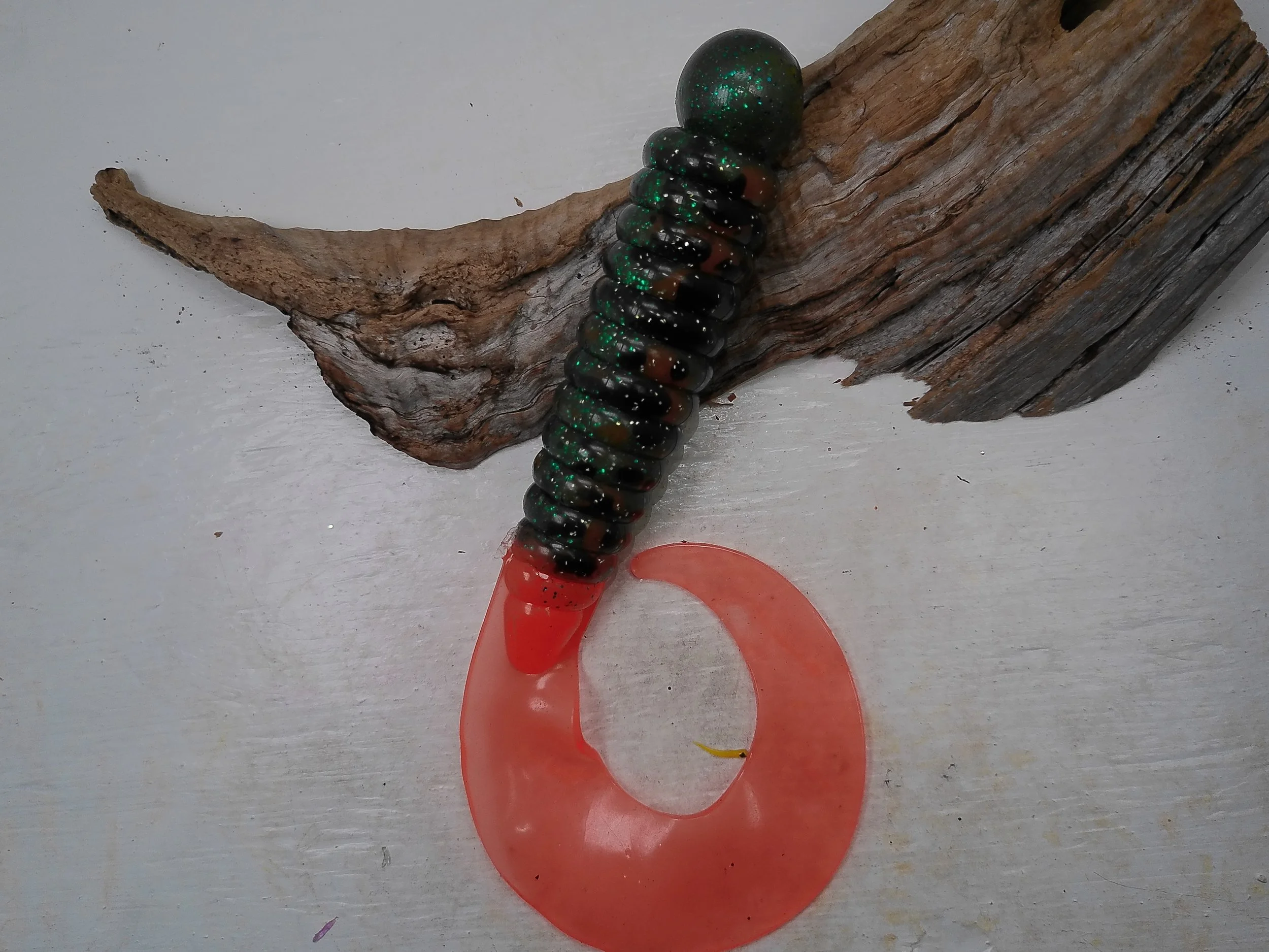 12-inch Chaney Creek deep sea fancy grub worm in Grass Green with Silver flake color with a translucent green tail