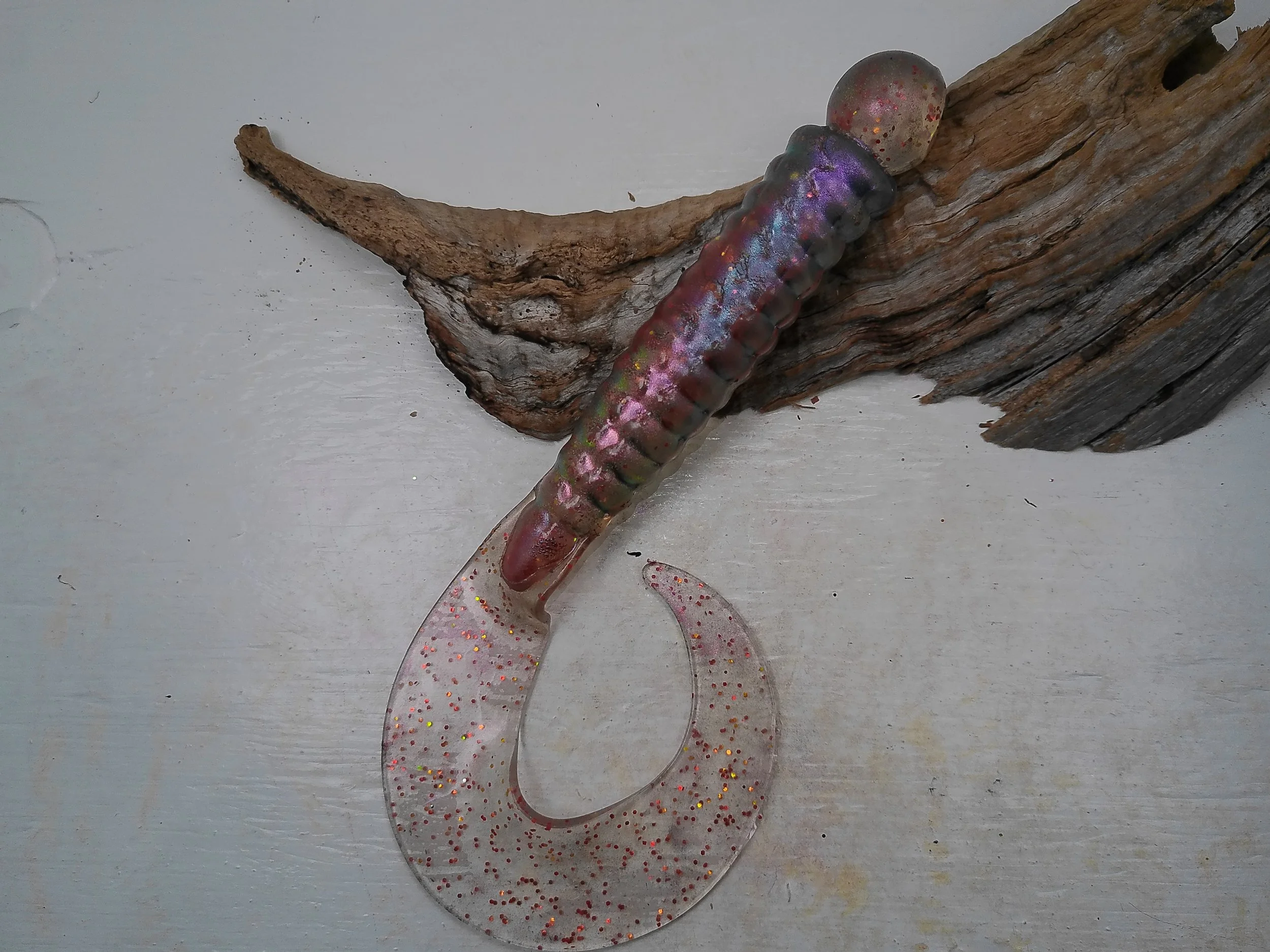 curly-tail-grub-fishing-lure-iridescent-purple-body-clear-speckled-tail