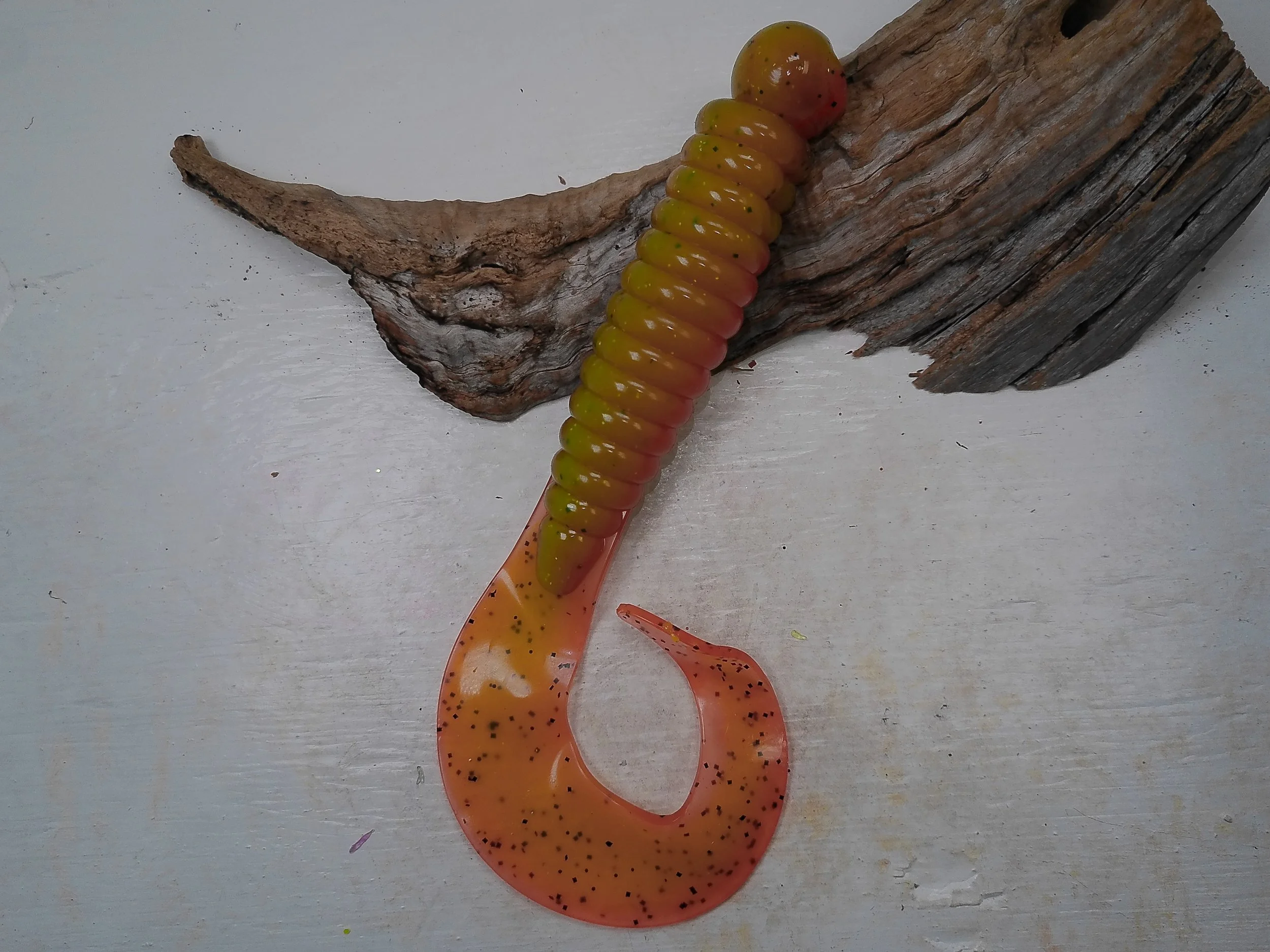 curly-tail-grub-fishing-lure-mustard-yellow-body-orange-speckled-tail