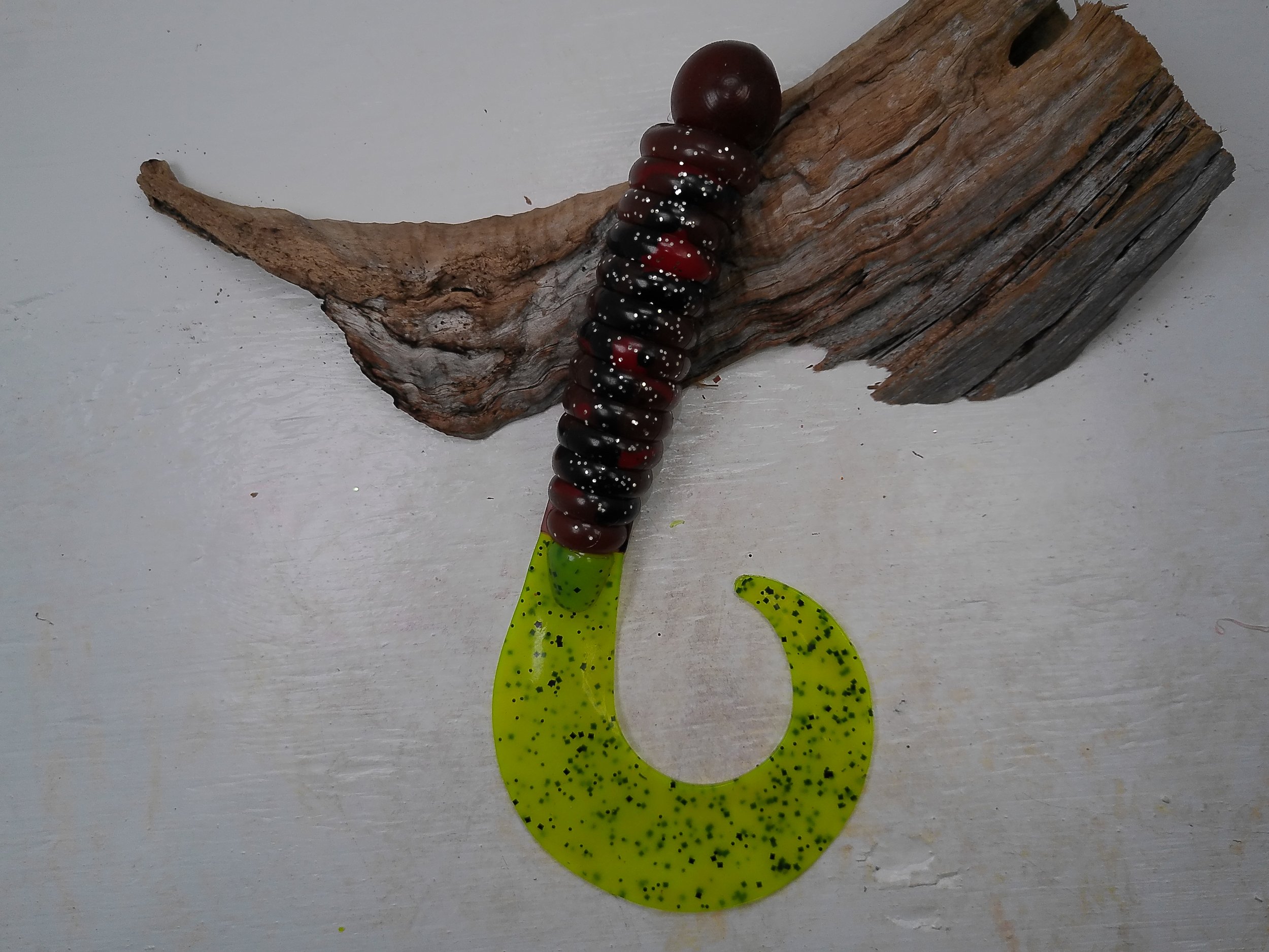 curly-tail-grub-fishing-lure-black-red-glitter-body-chartreuse-tail