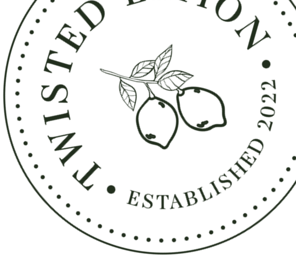 Close-up of a circular logo with lemon branch in the center and text around it that reads "WILD EST. 2022" and "ESTABLISHED 2022."