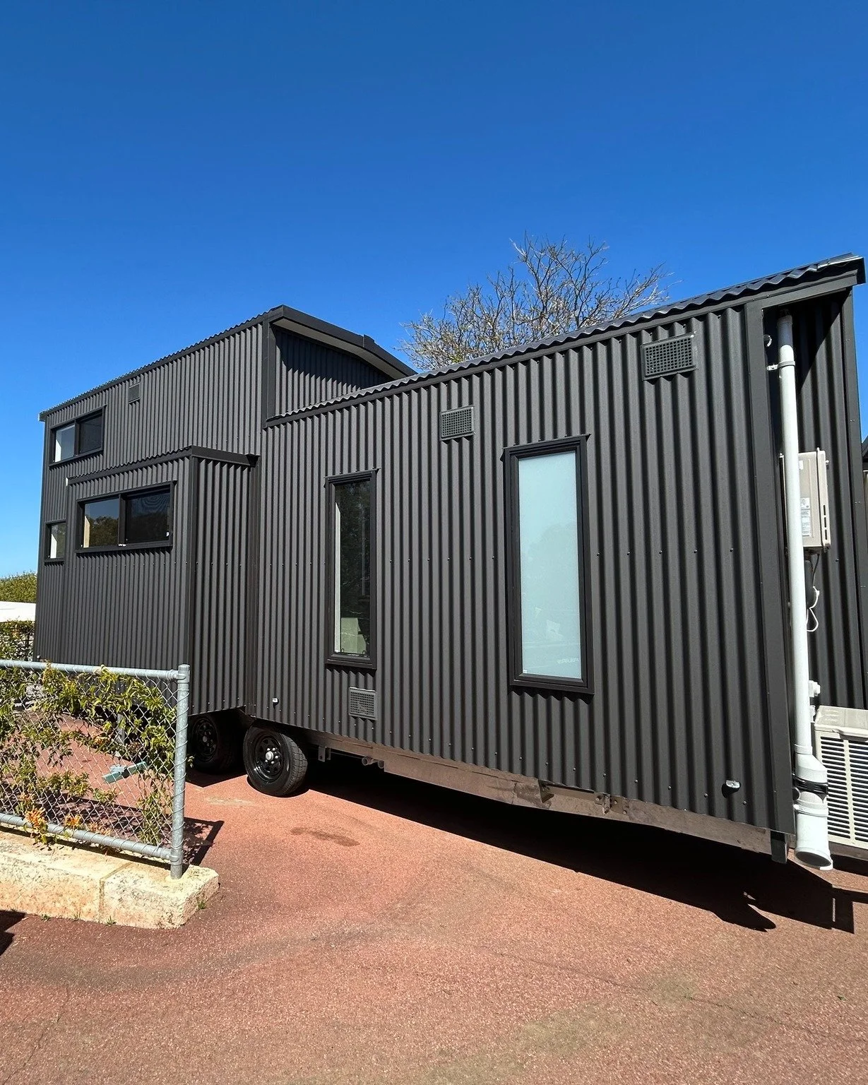 Introducing The Slide: Our latest design concept that takes tiny living to the next level. This innovative feature extends the side of the home to create extra space and flexibility tailored to your lifestyle.