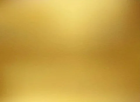 Close-up of a yellow surface with a gradient effect.