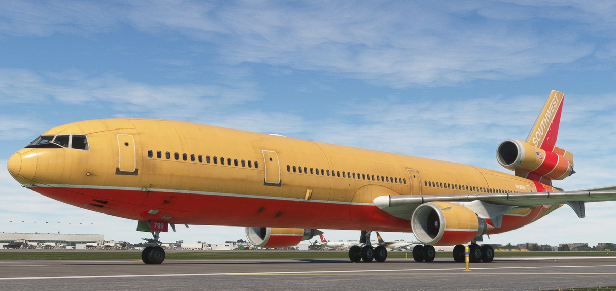 A Southwest Airlines jet painted to resemble a banana, with yellow and red colors and a banana shape design.