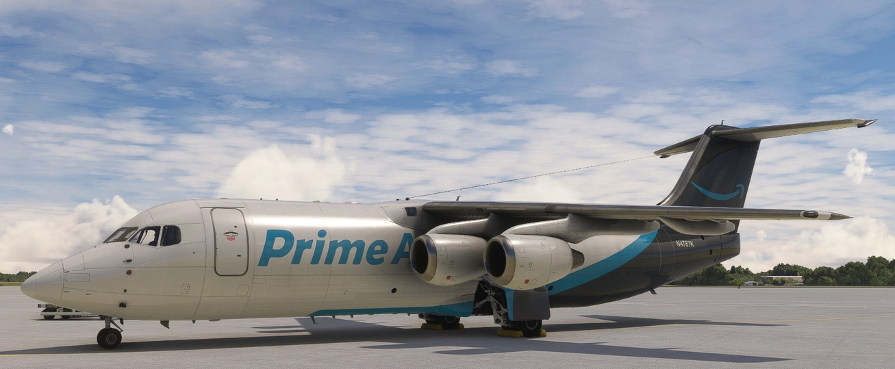 An Amazon Prime Air cargo airplane parked on a tarmac with a cloudy sky above.