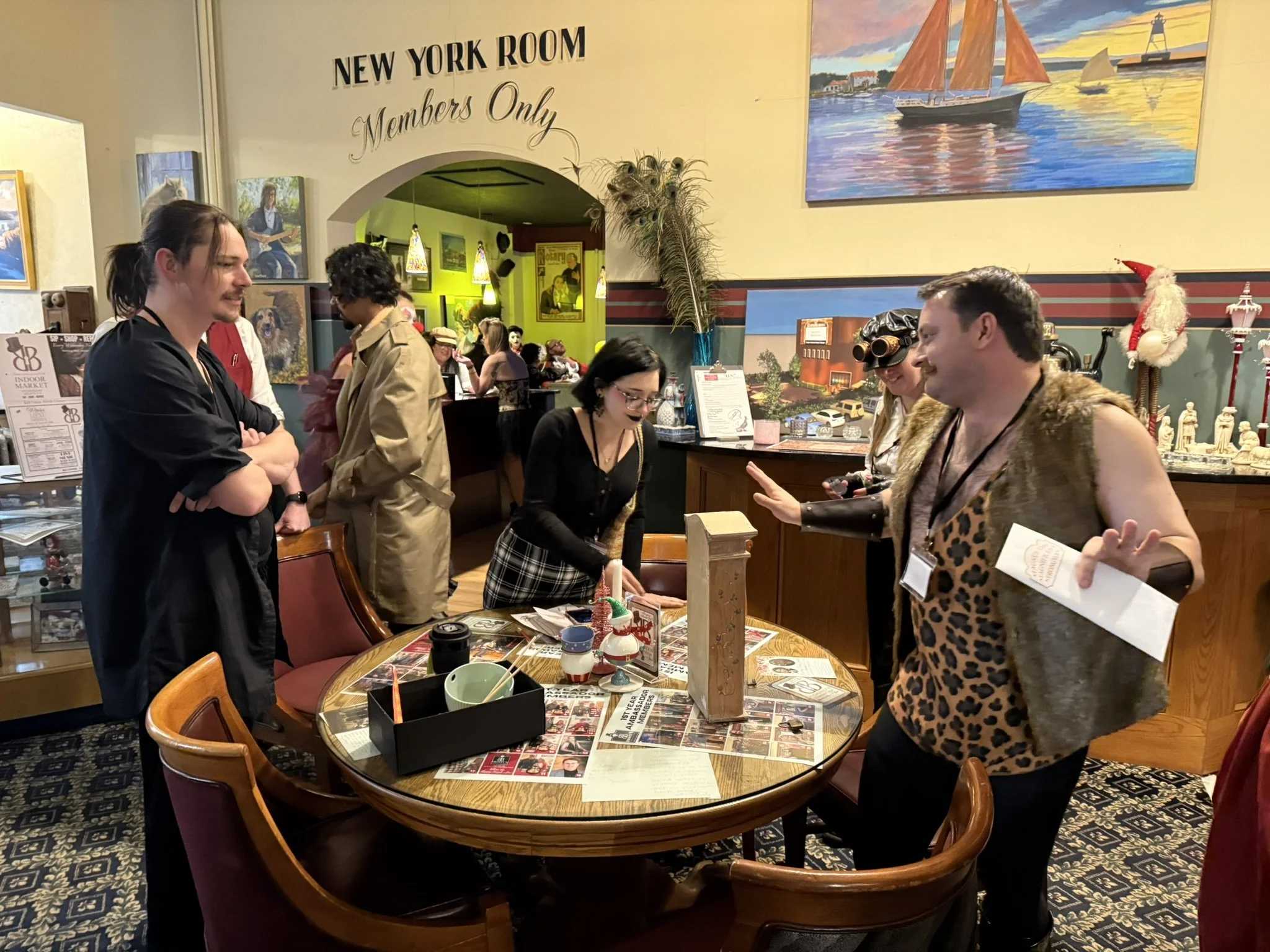 Costumed carnival guests in a heated discussion about puzzles at a festive gathering inside a restaurant, with a sign reading 'New York Room Members Only'