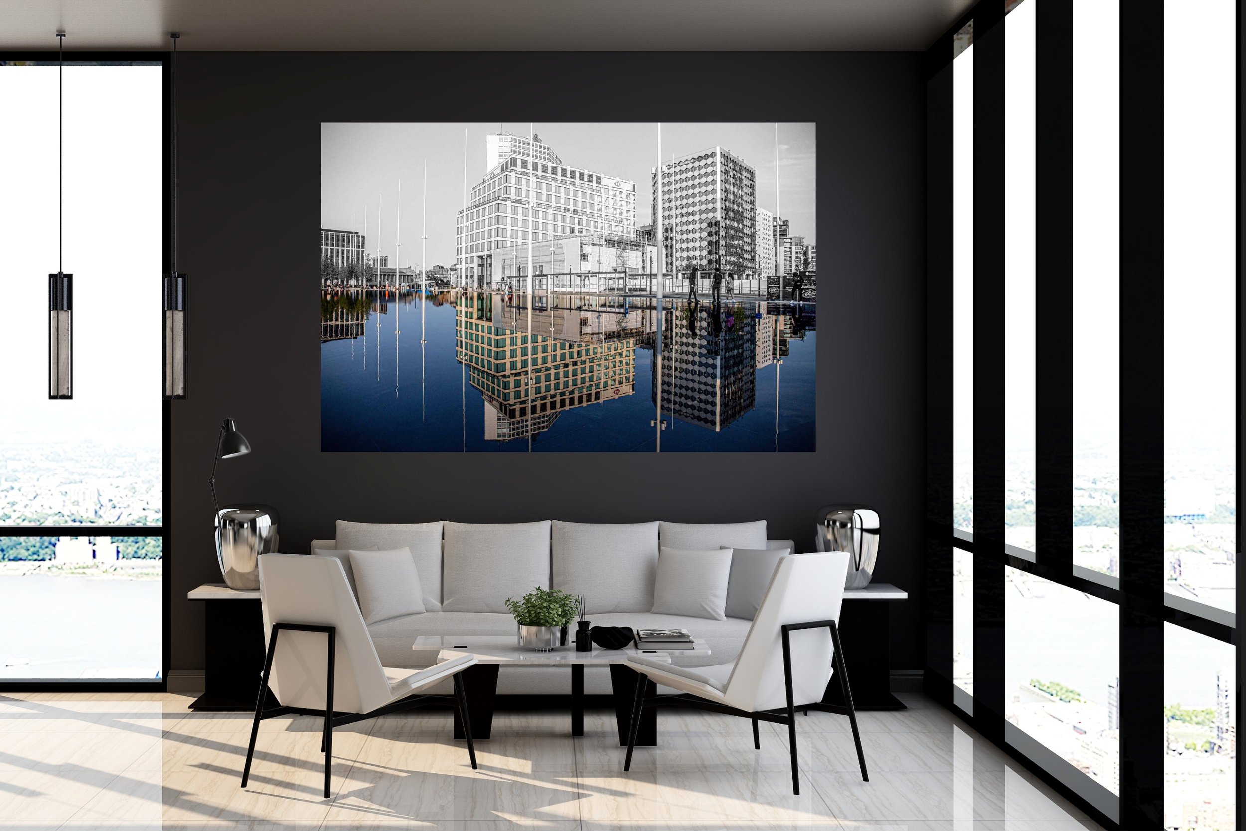 Modern office space with white seating area, full height windows flooding the room with light and a stunning print of Birmingham taking up the entire wall, inviting conversation as the sky appears to have fallen...