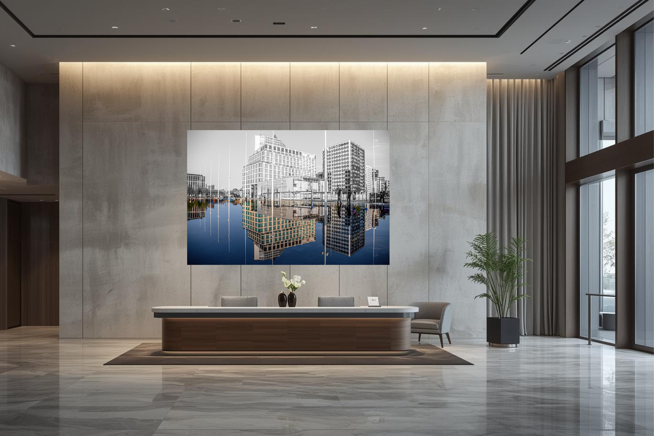 Corporate office reception and a large photo print of city buildings reflected in water hanging on the wall. 