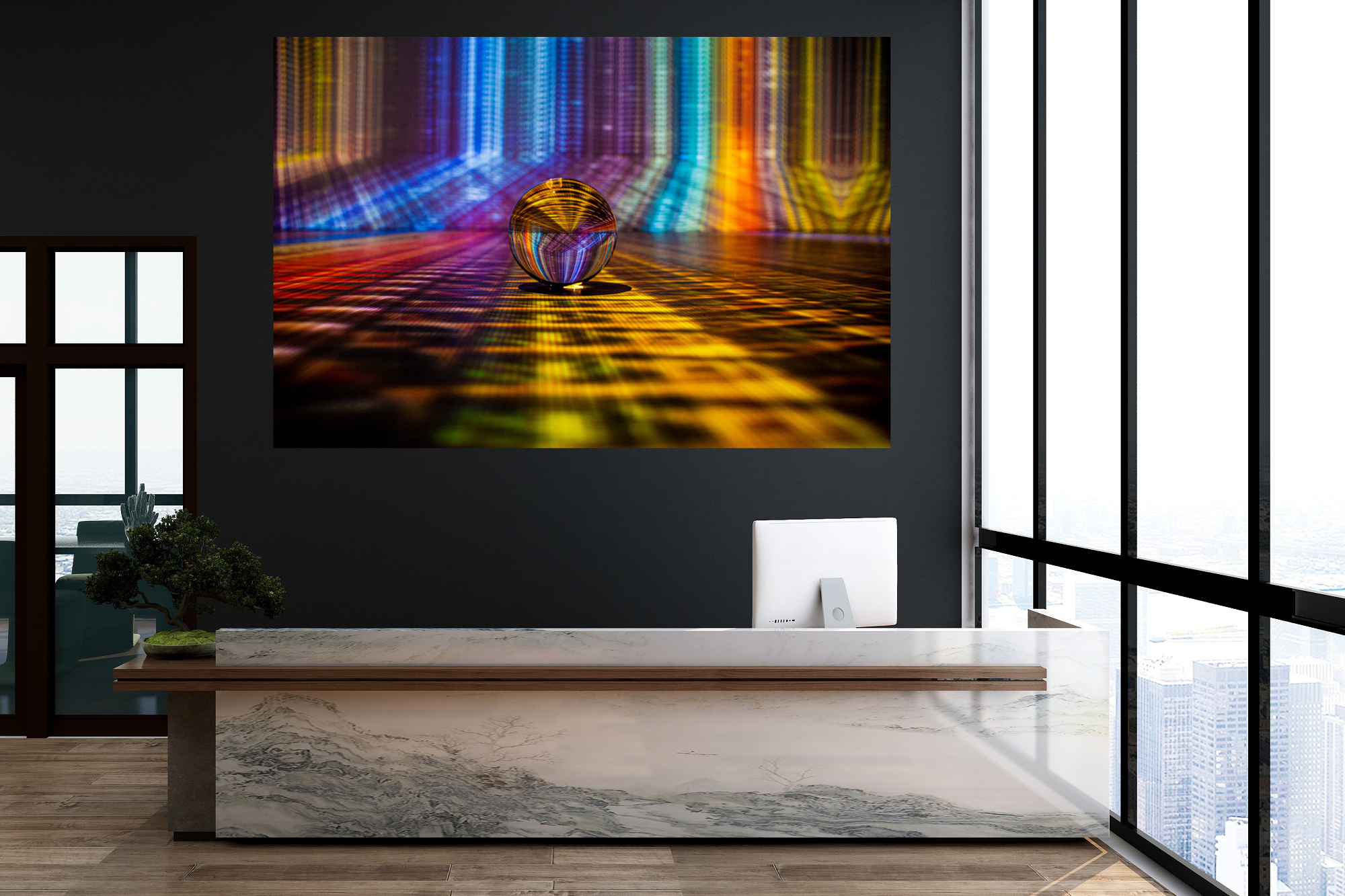 Modern office reception desk with a abstract digital art piece on the wall behind, a small bonsai plant on the left, and large floor-to-ceiling windows showing a city skyline.
